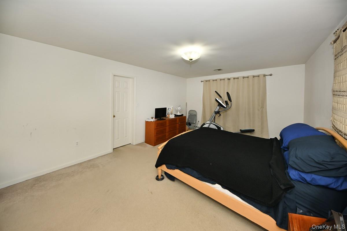 14 Roble Road Suffern, NY 10901 - Photo 22 of 30 Bedroom featuring light colored carpet and baseboards