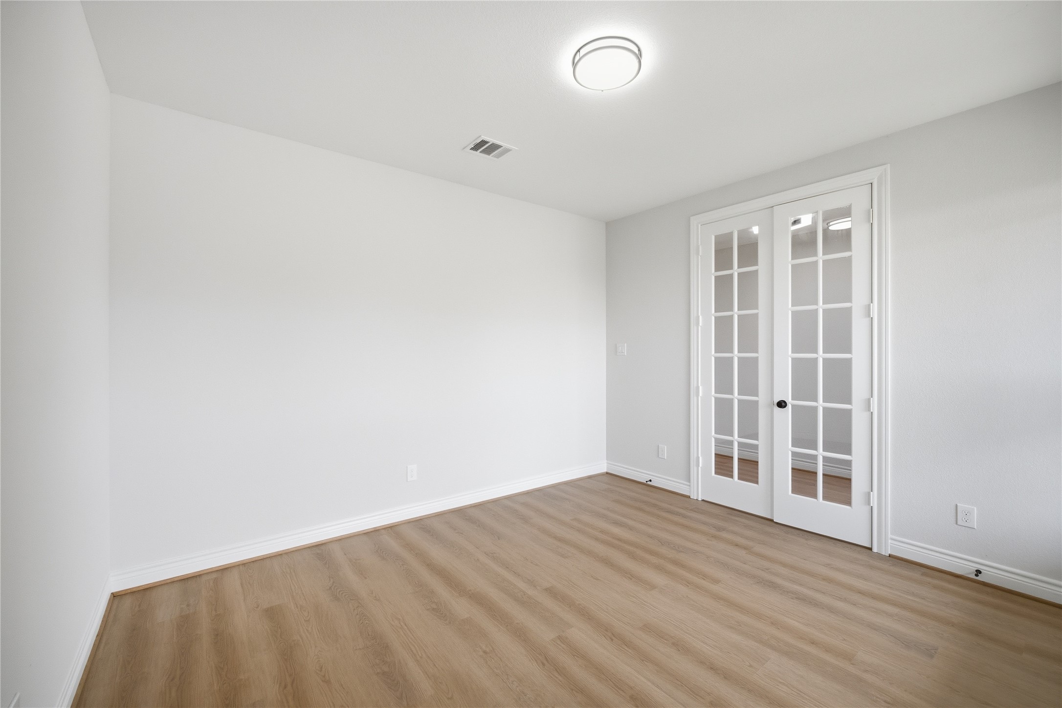 114 Par Circle La Porte, TX 77571 - Photo 4 of 33 Double glass doors offer privacy, creating a functional space for meetings.