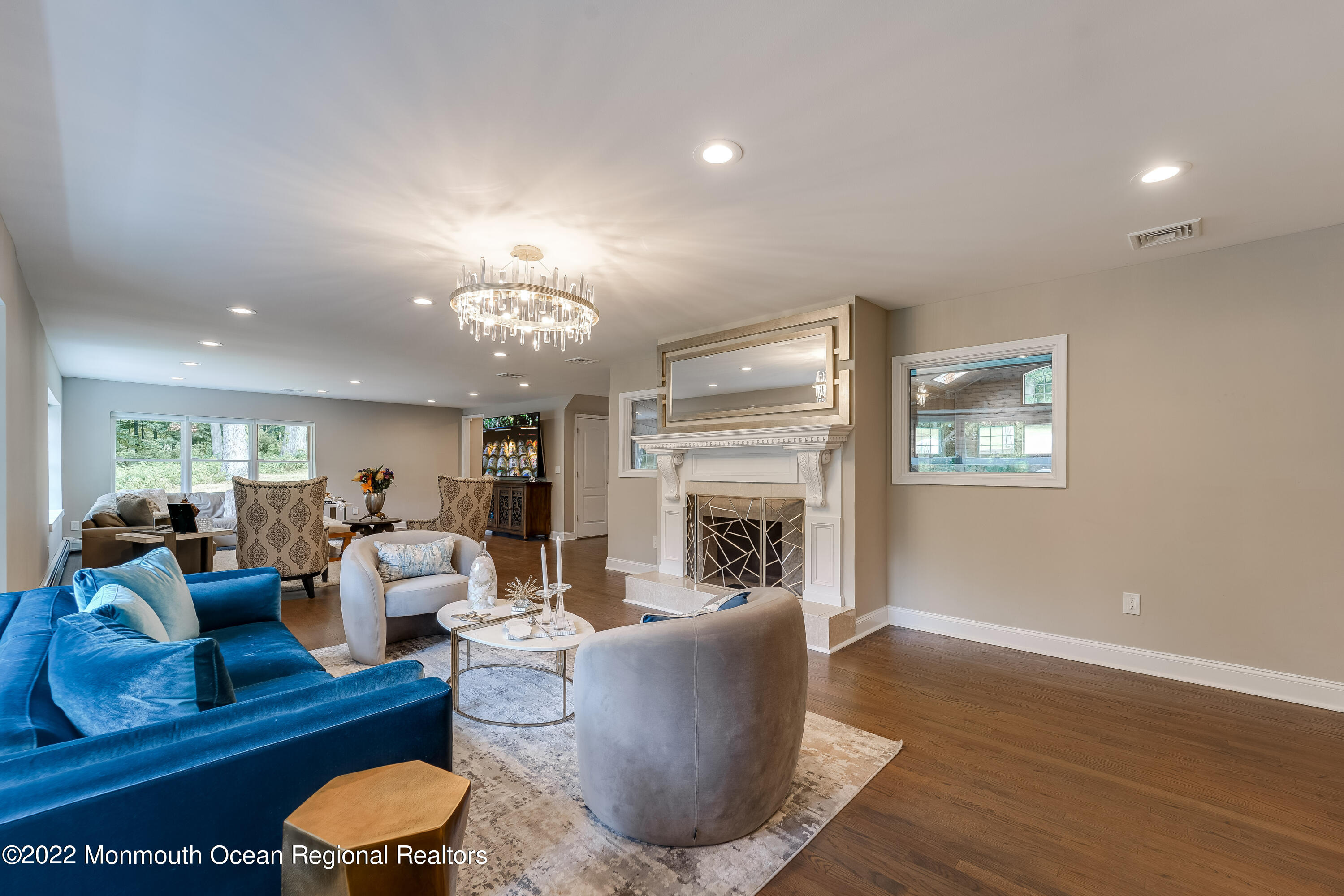 77 Pleasant Hill Road Randolph, NJ 07869 - Photo 16 of 85 a living room with furniture a fireplace and a chandelier