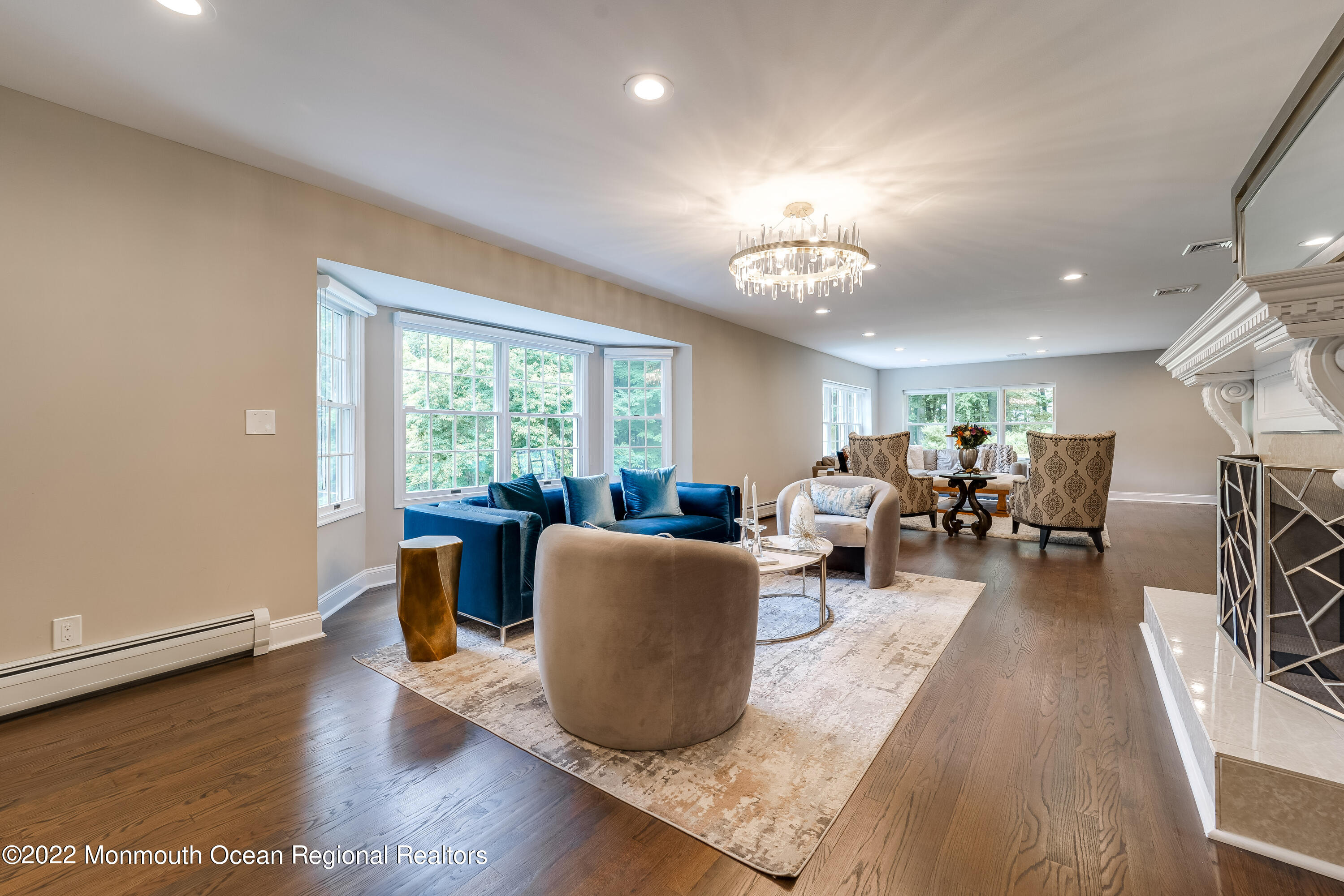 77 Pleasant Hill Road Randolph, NJ 07869 - Photo 17 of 85 a living room with furniture a fireplace and a table