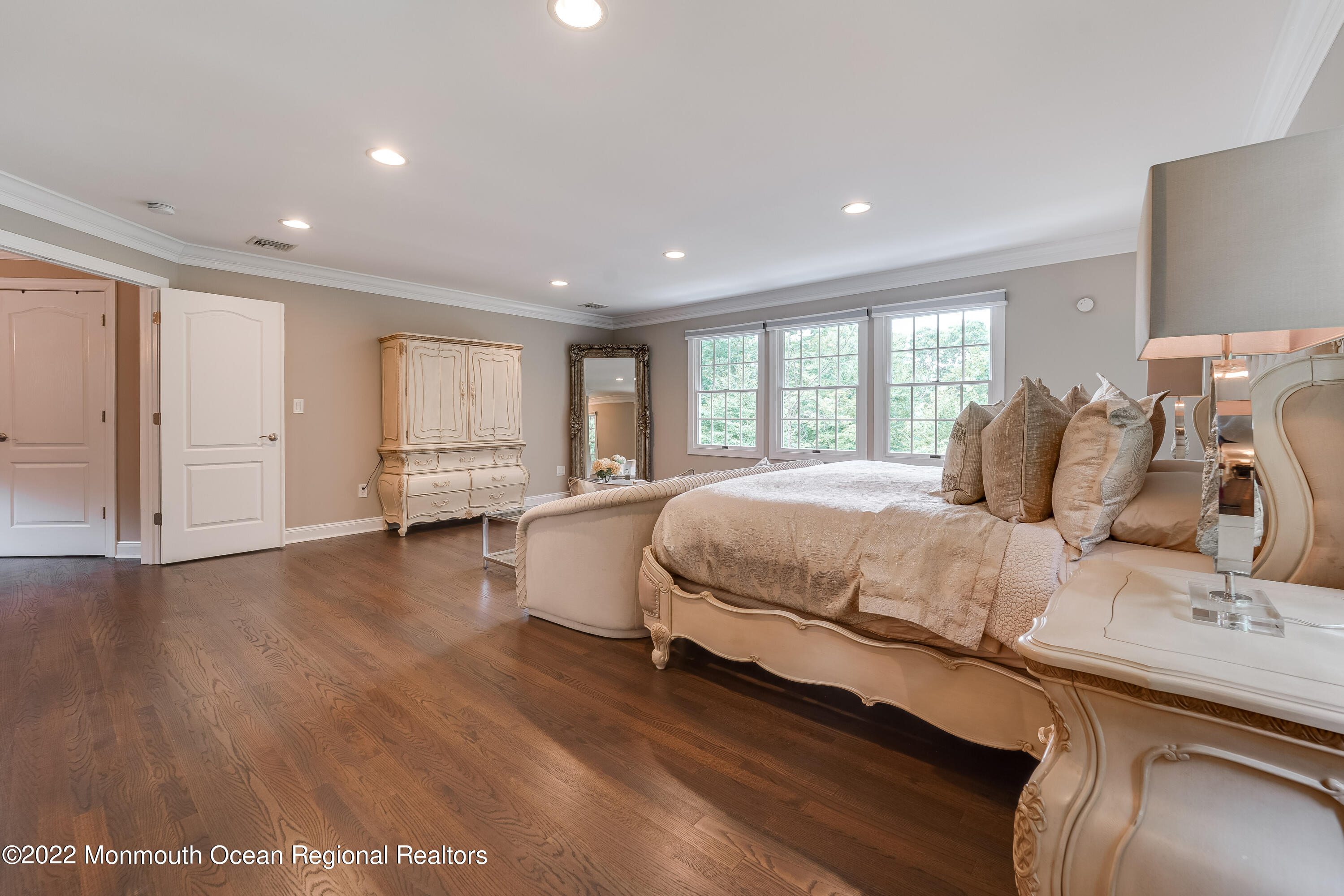 77 Pleasant Hill Road Randolph, NJ 07869 - Photo 34 of 85 a spacious bedroom with a large bed and wooden floor