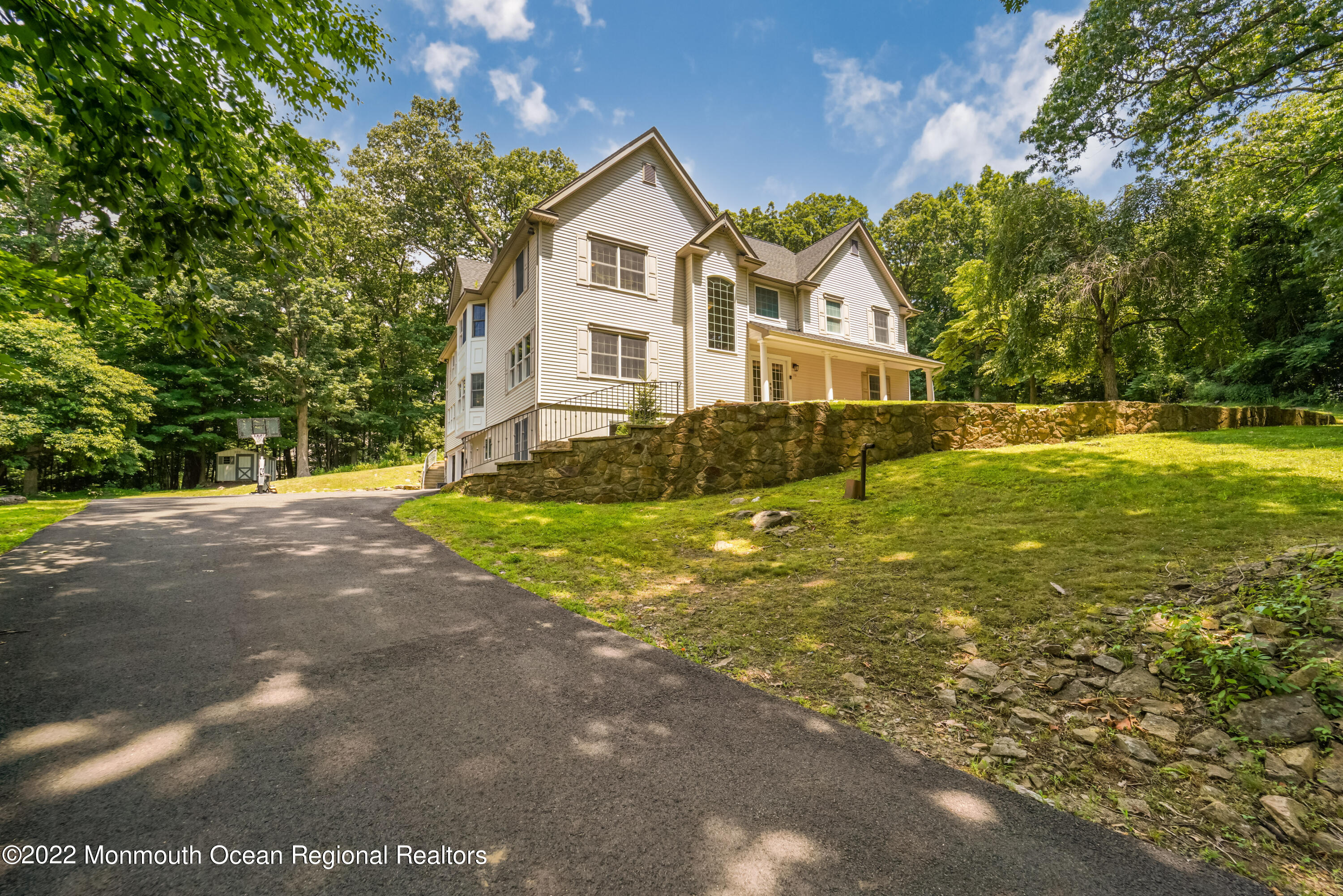 77 Pleasant Hill Road Randolph, NJ 07869 - Photo 77 of 85 a front view of a house with a yard and garage