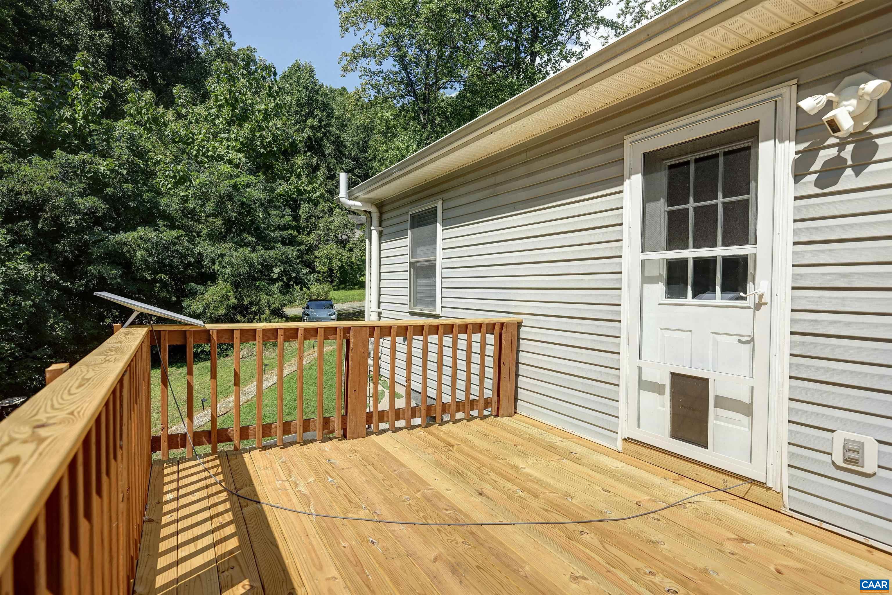 14 High View Road Stanardsville, VA 22973 - Photo 11 of 41 a view of balcony with wooden floor and fence and a large window