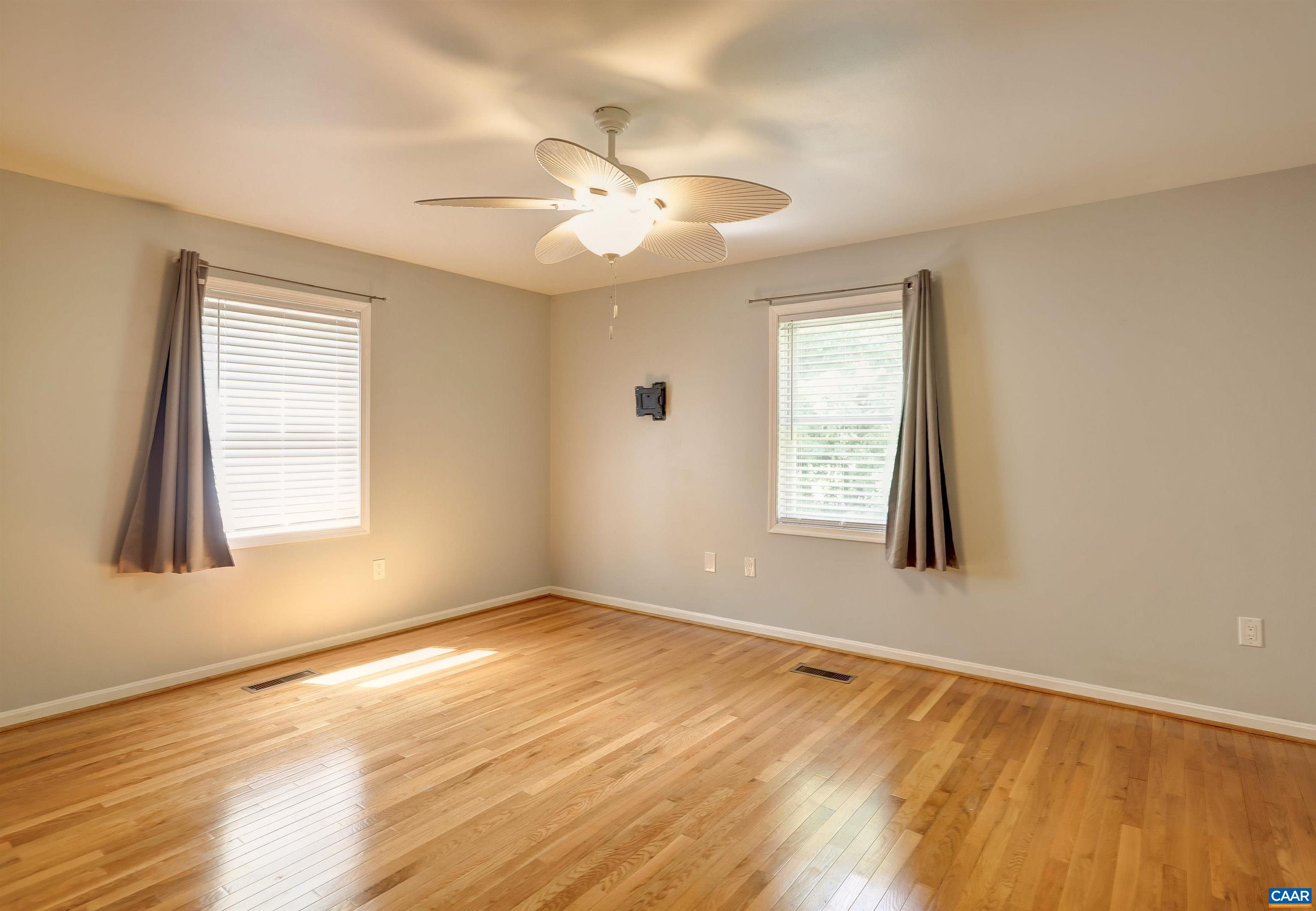 14 High View Road Stanardsville, VA 22973 - Photo 14 of 41 a view of an empty room with wooden floor and a window