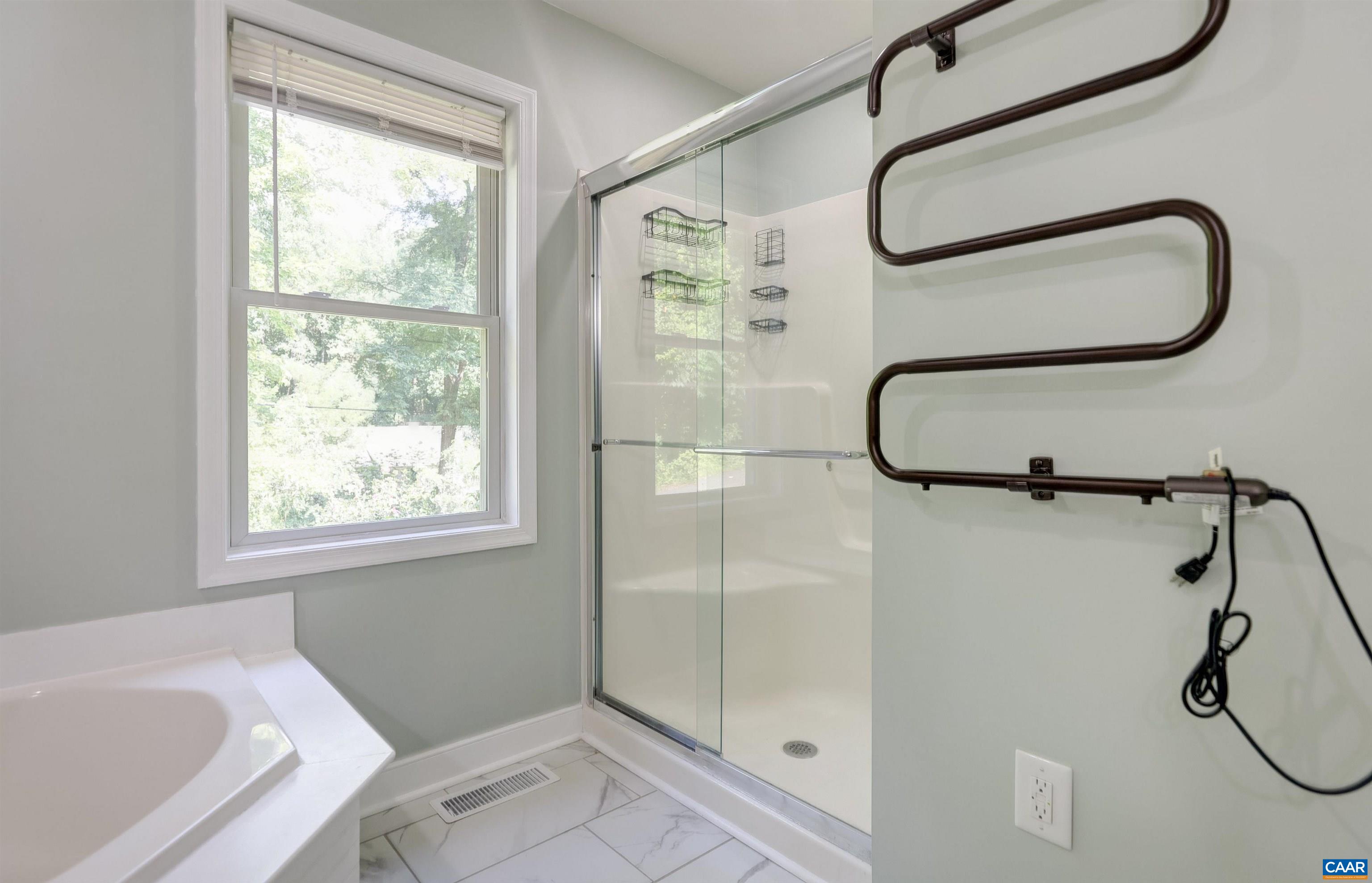 14 High View Road Stanardsville, VA 22973 - Photo 16 of 41 a bathroom with a glass shower door and a window