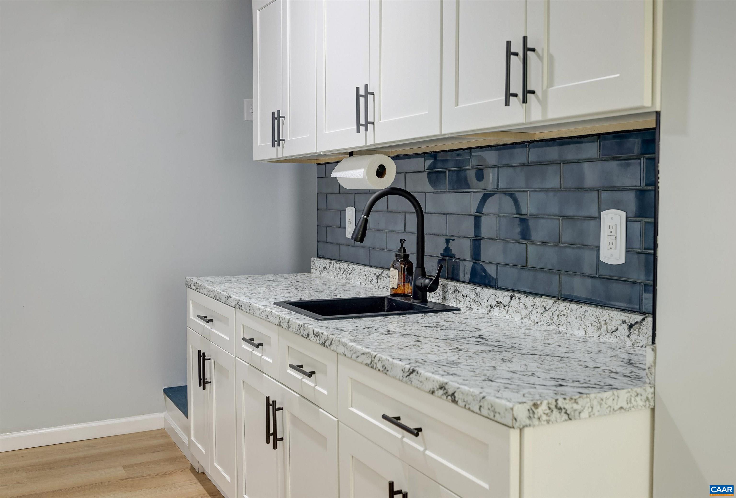 14 High View Road Stanardsville, VA 22973 - Photo 20 of 41 a kitchen with granite countertop a sink and cabinets