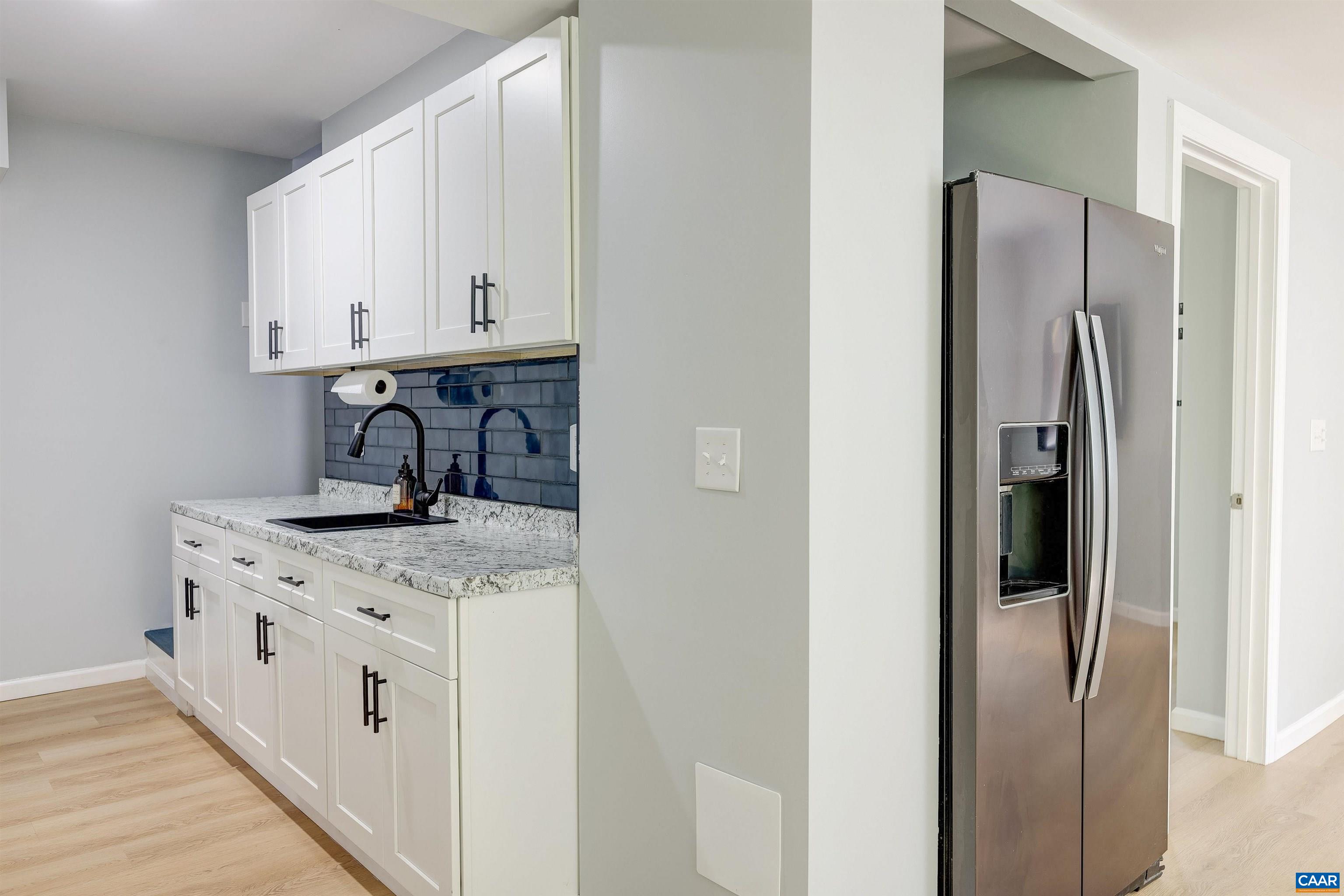 14 High View Road Stanardsville, VA 22973 - Photo 21 of 41 a kitchen with stainless steel appliances granite countertop white cabinets and a refrigerator