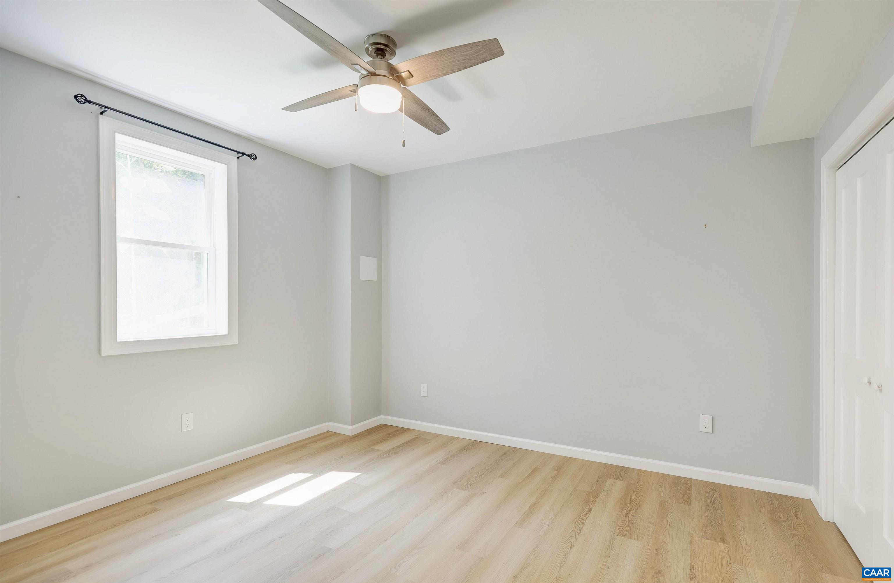 14 High View Road Stanardsville, VA 22973 - Photo 27 of 41 an empty room with a window and a fan