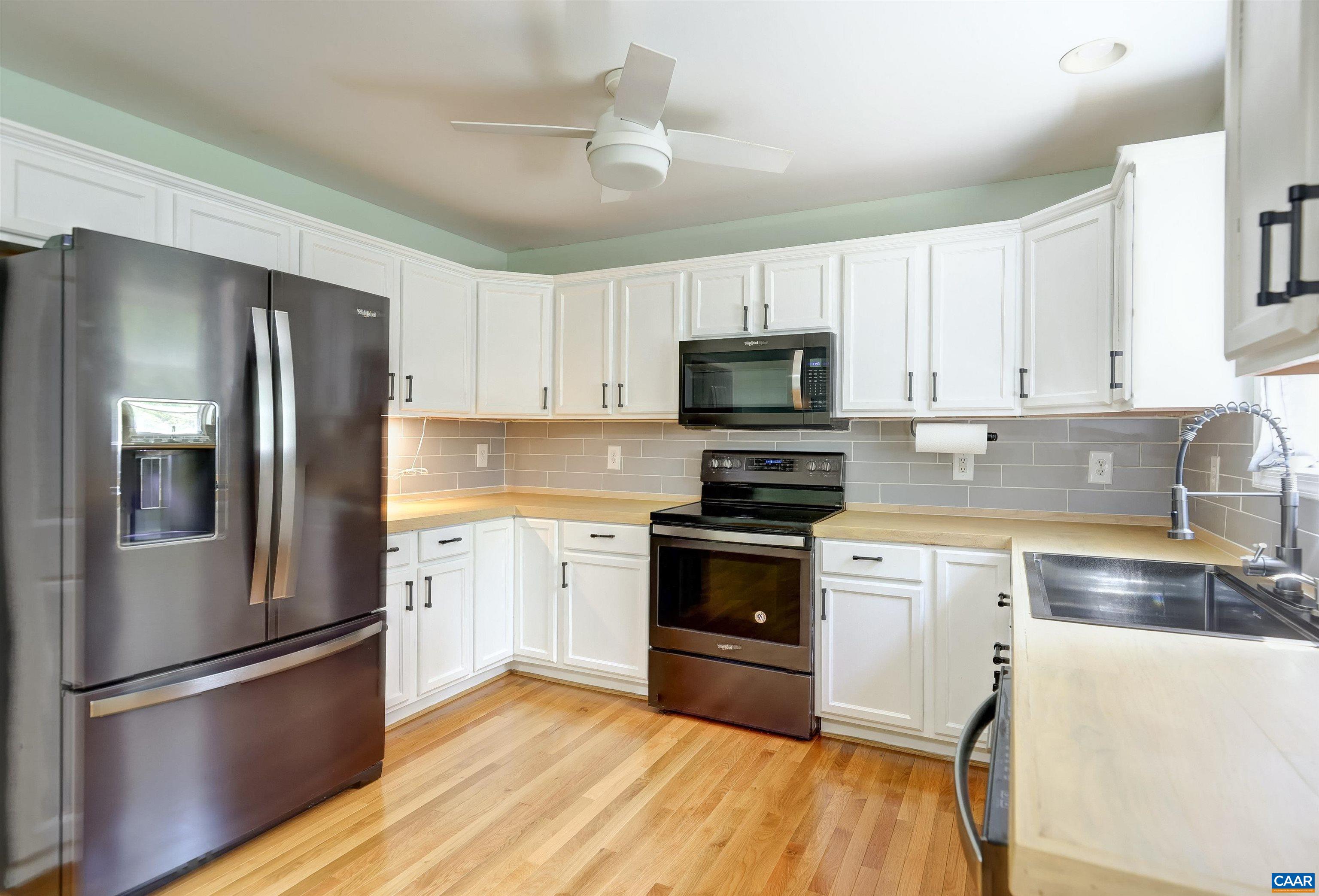 14 High View Road Stanardsville, VA 22973 - Photo 9 of 41 a kitchen with granite countertop a refrigerator stove and sink