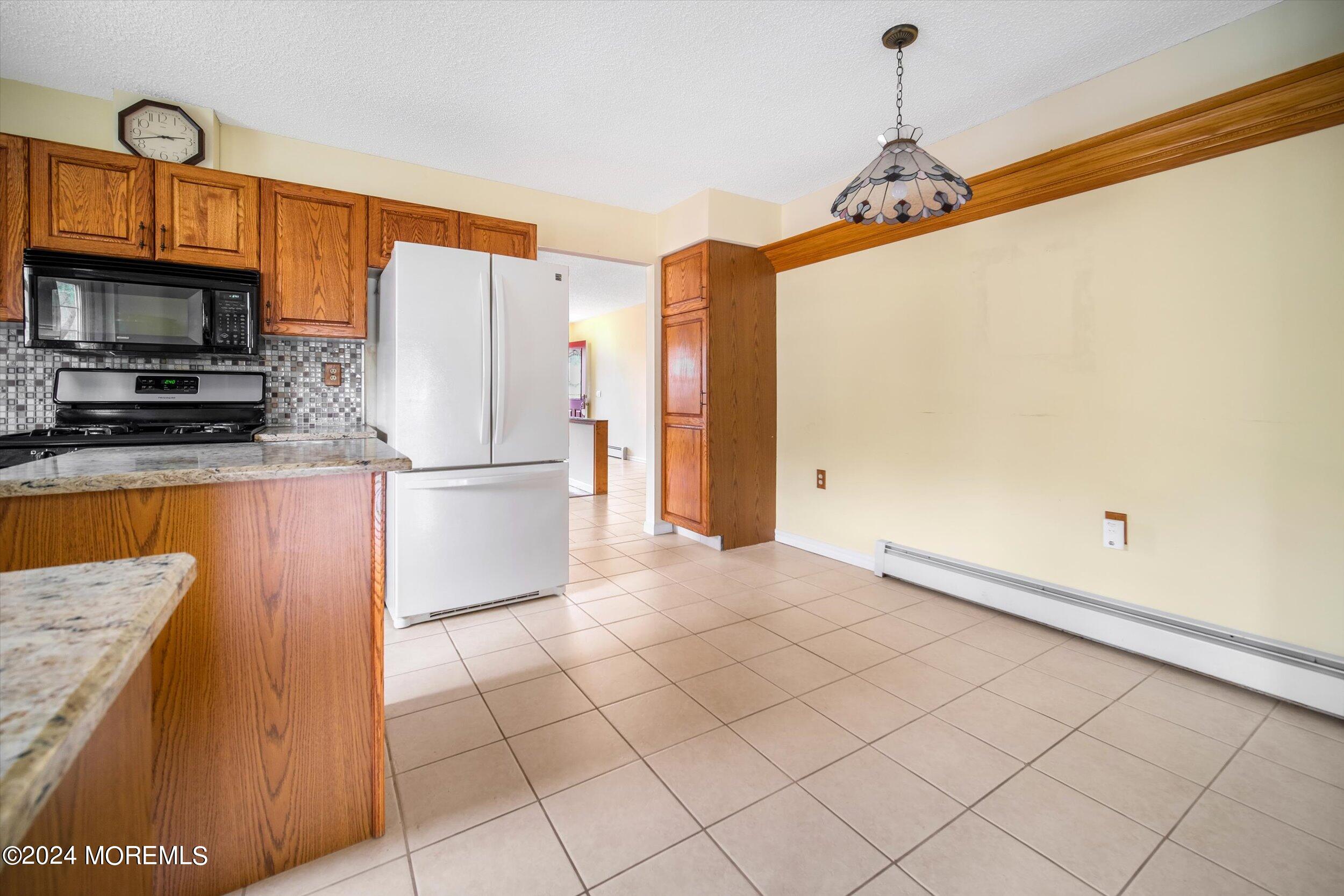 1 Lambert Way Toms River, NJ 08757 - Photo 16 of 26 a view of a kitchen with a sink and refrigerator
