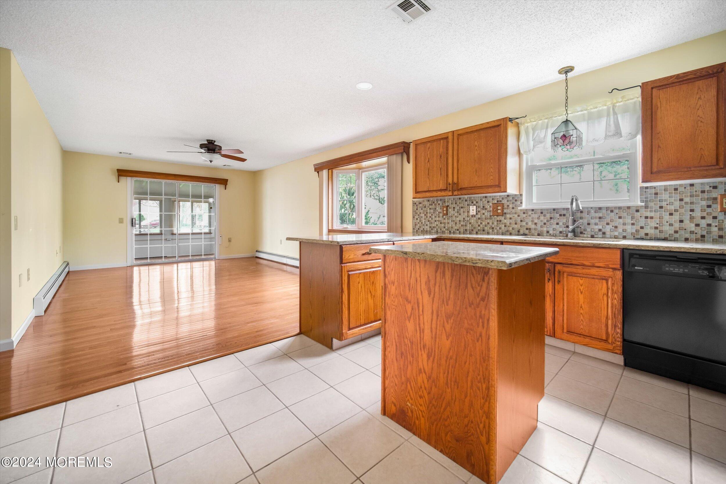1 Lambert Way Toms River, NJ 08757 - Photo 17 of 26 a kitchen with stainless steel appliances granite countertop a stove a sink and a microwave
