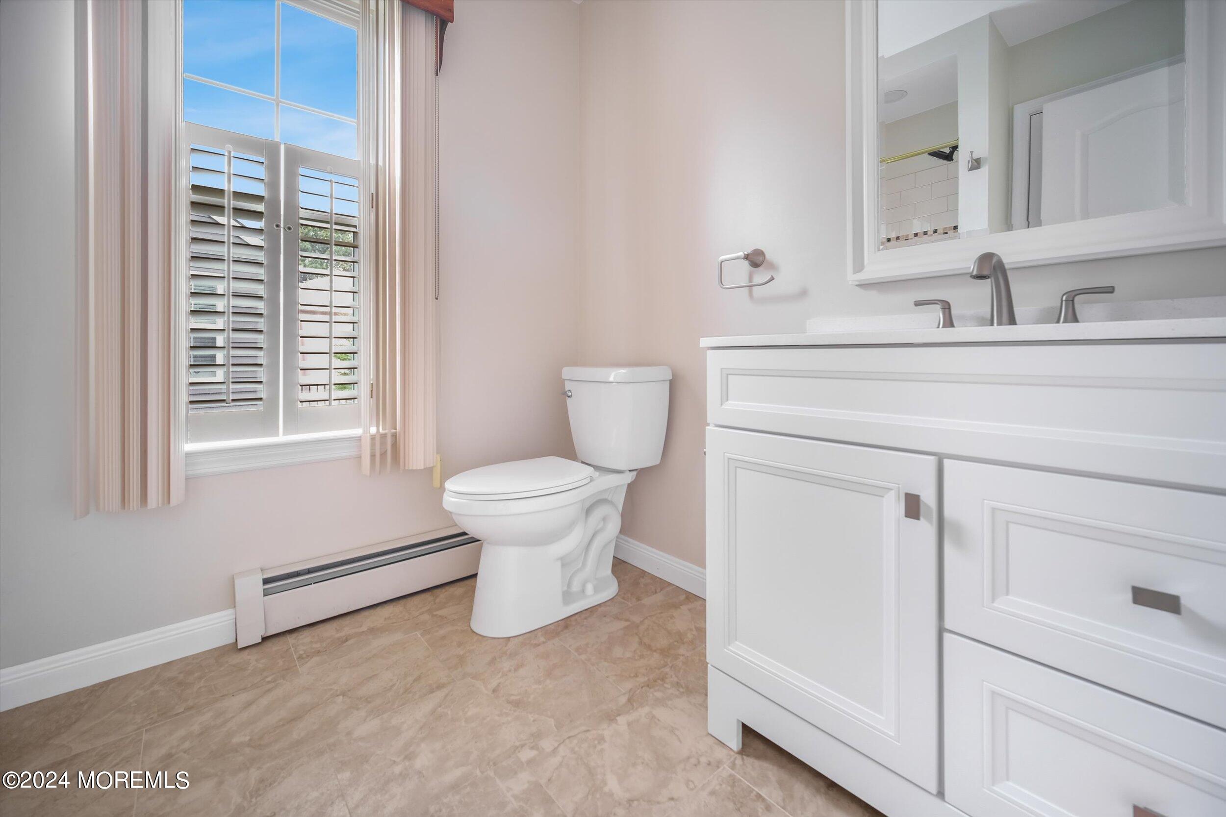 1 Lambert Way Toms River, NJ 08757 - Photo 21 of 26 a bathroom with a sink toilet and window