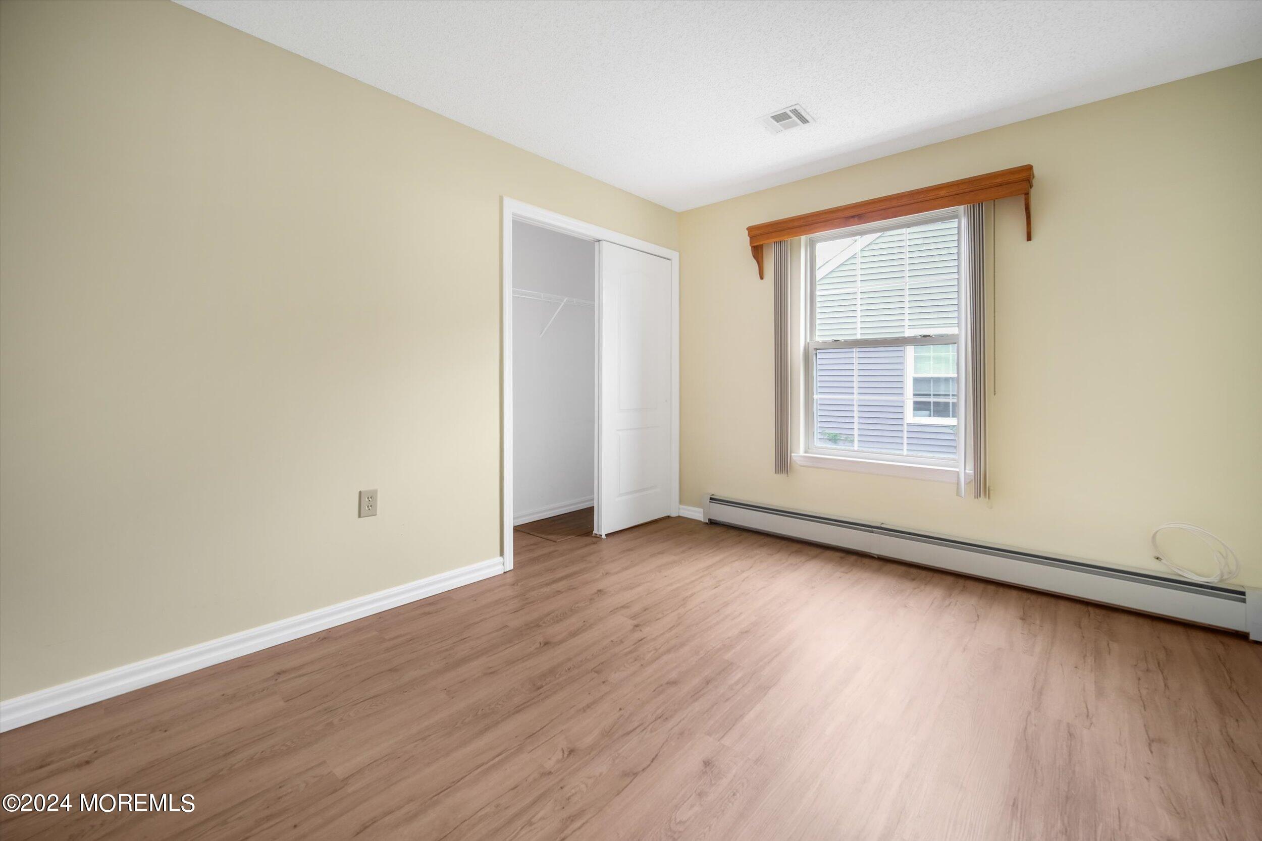 1 Lambert Way Toms River, NJ 08757 - Photo 24 of 26 an empty room with wooden floor and windows