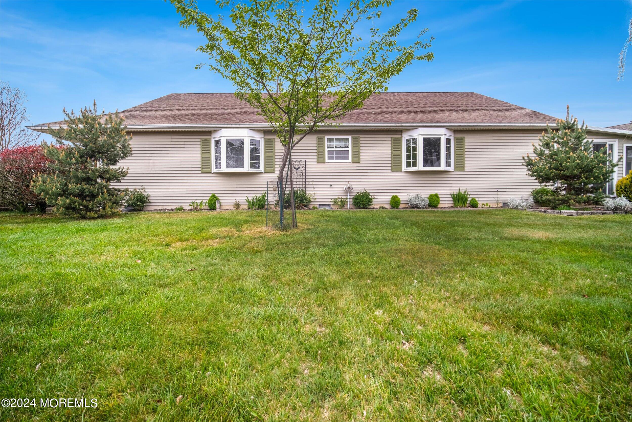 1 Lambert Way Toms River, NJ 08757 - Photo 3 of 26 a front view of a house with a garden