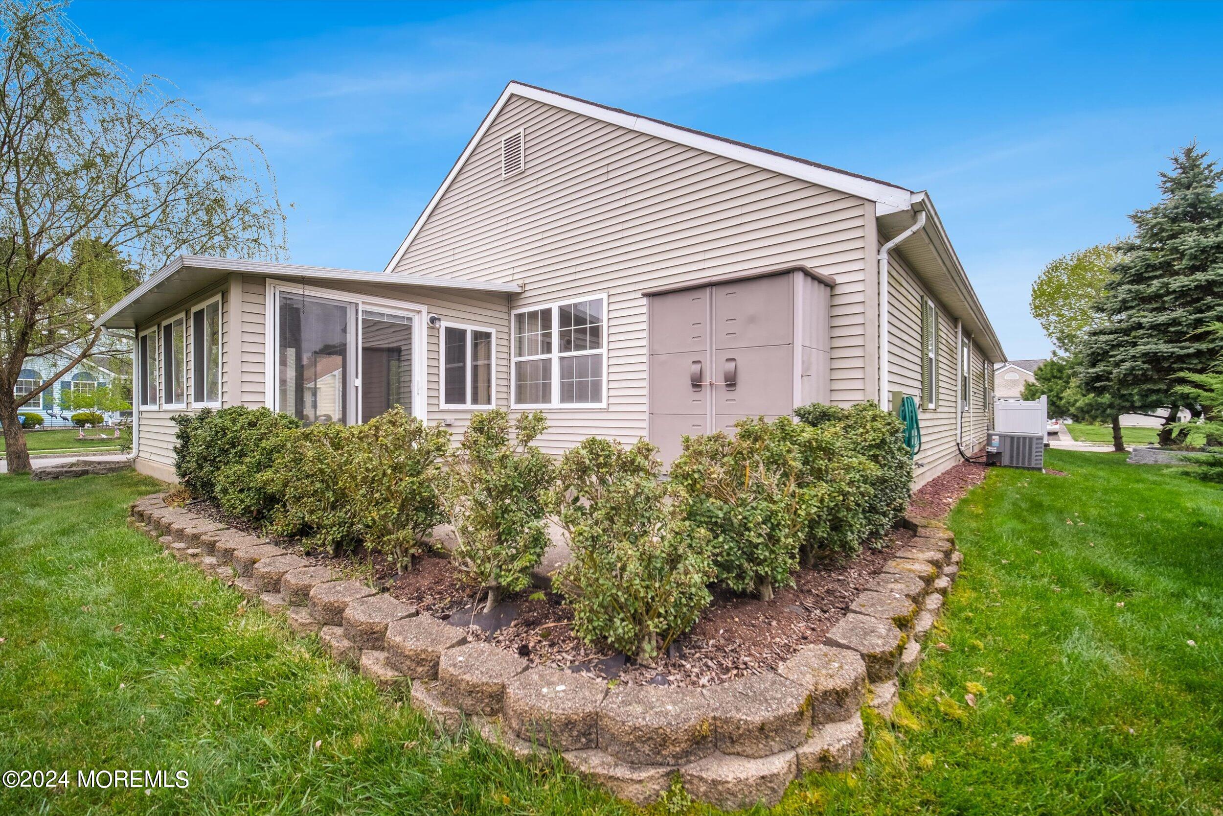 1 Lambert Way Toms River, NJ 08757 - Photo 5 of 26 a front view of a house with a yard