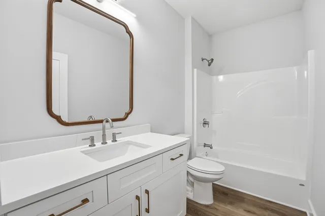 a kitchen with microwave stove and cabinets