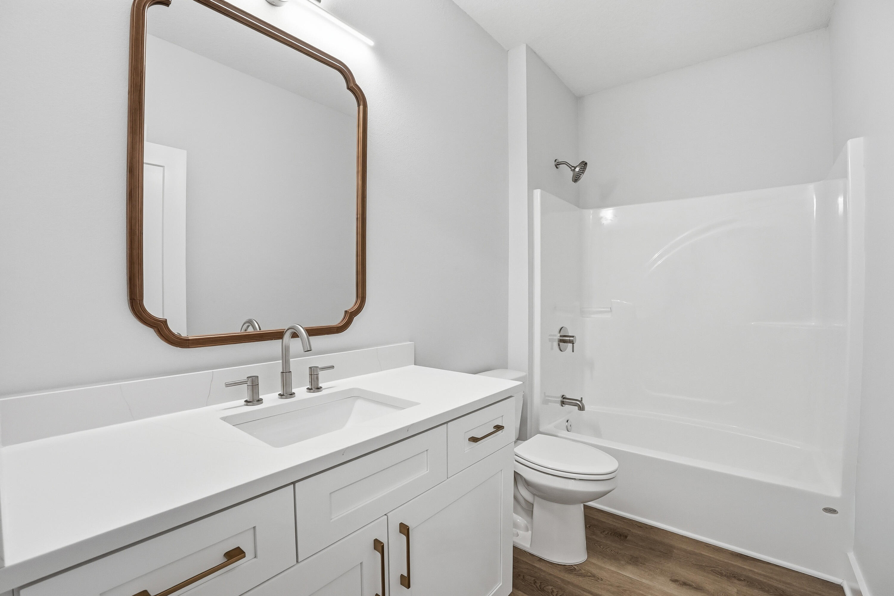 15 Plew Avenue Shalimar, FL 32579 - Photo 15 of 67 a bathroom with a toilet a sink a mirror and shower