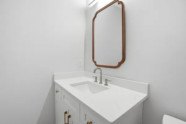 a close view of a sink a faucet and appliance in the kitchen