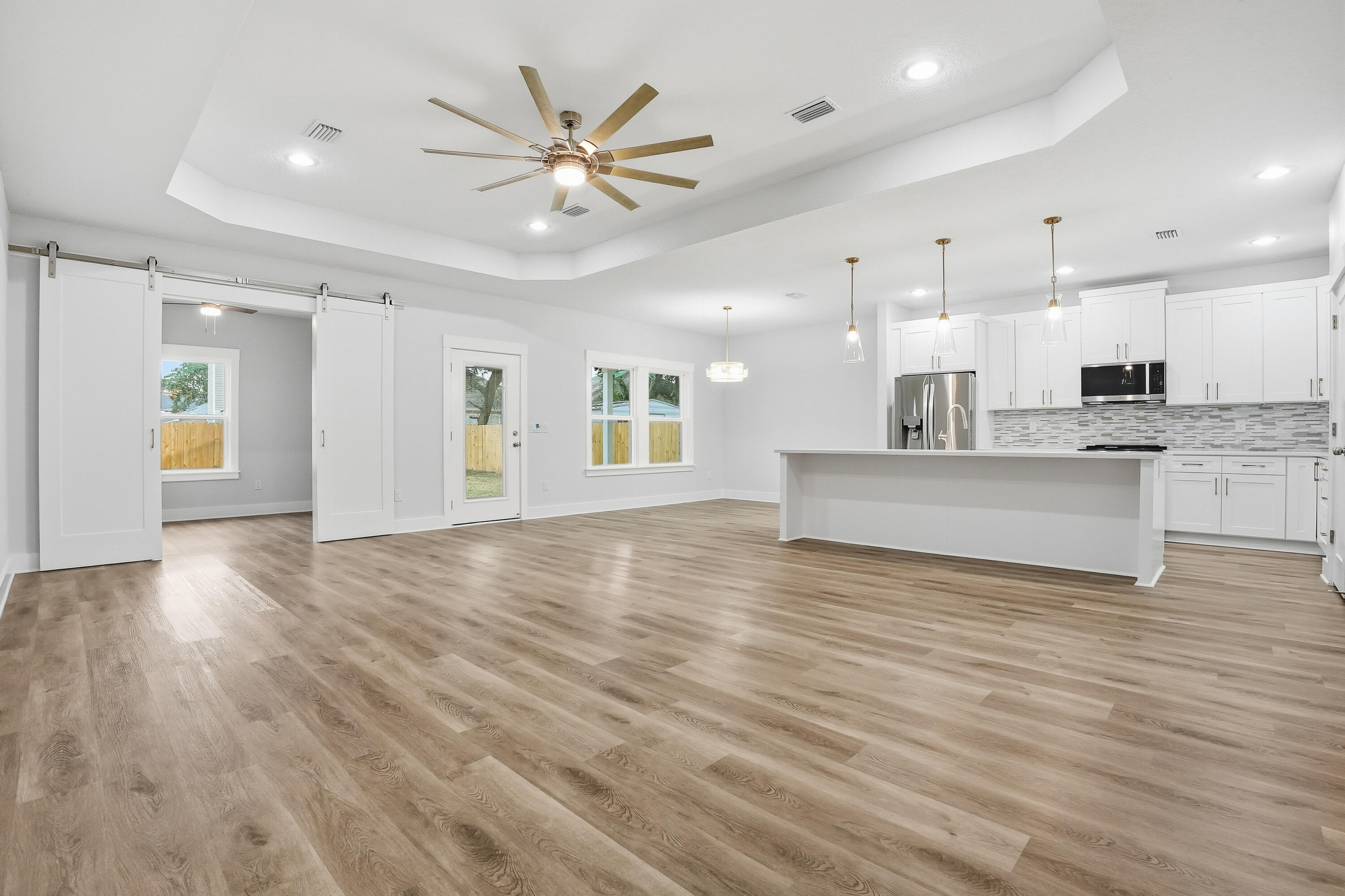 15 Plew Avenue Shalimar, FL 32579 - Photo 30 of 67 a view of a kitchen with a stove cabinets and wooden floor