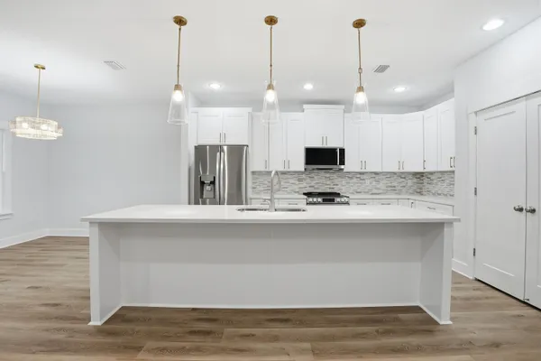 a view of room with window and hardwood floor