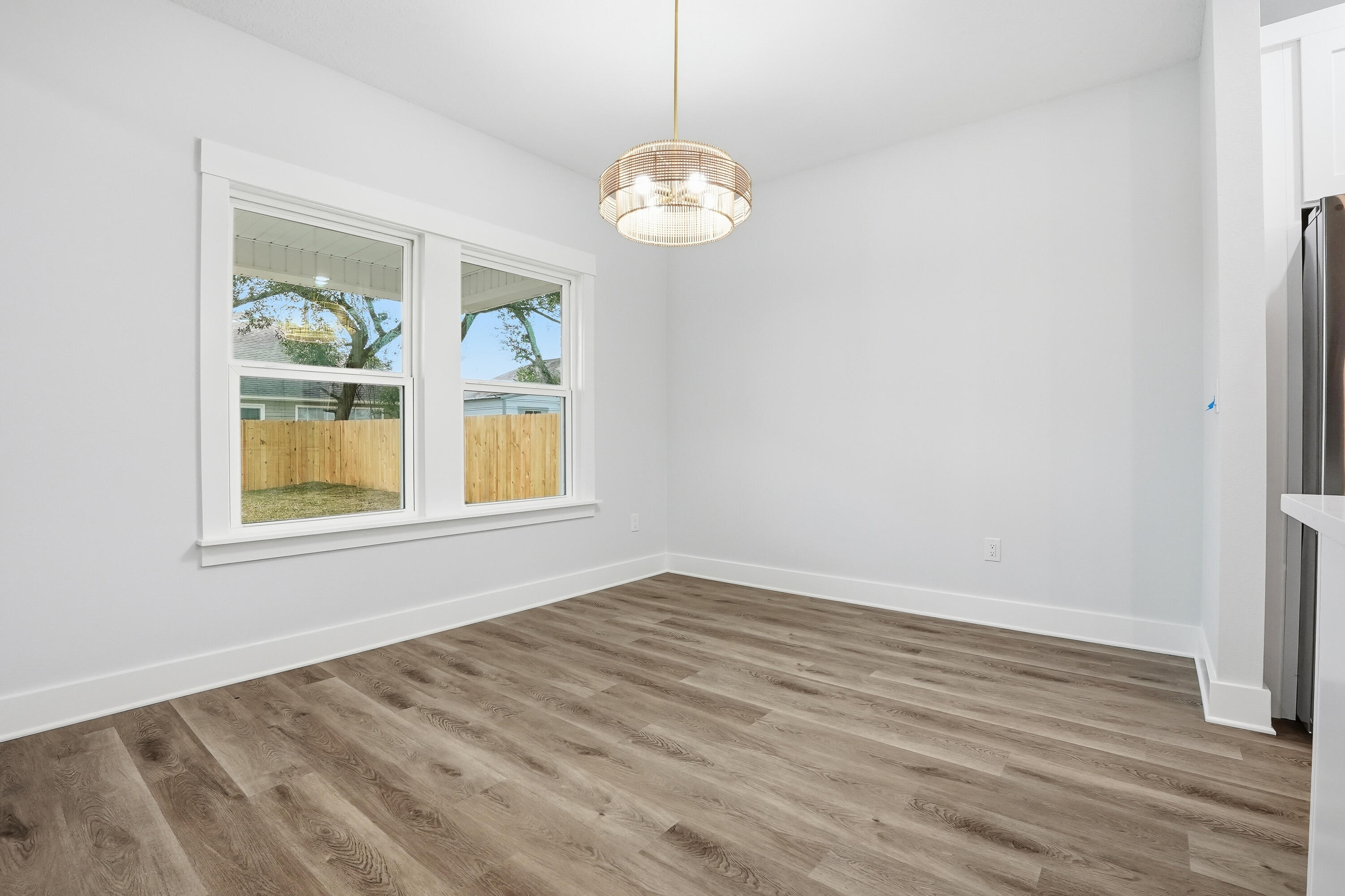 15 Plew Avenue Shalimar, FL 32579 - Photo 40 of 67 a view of an empty room with window and wooden floor