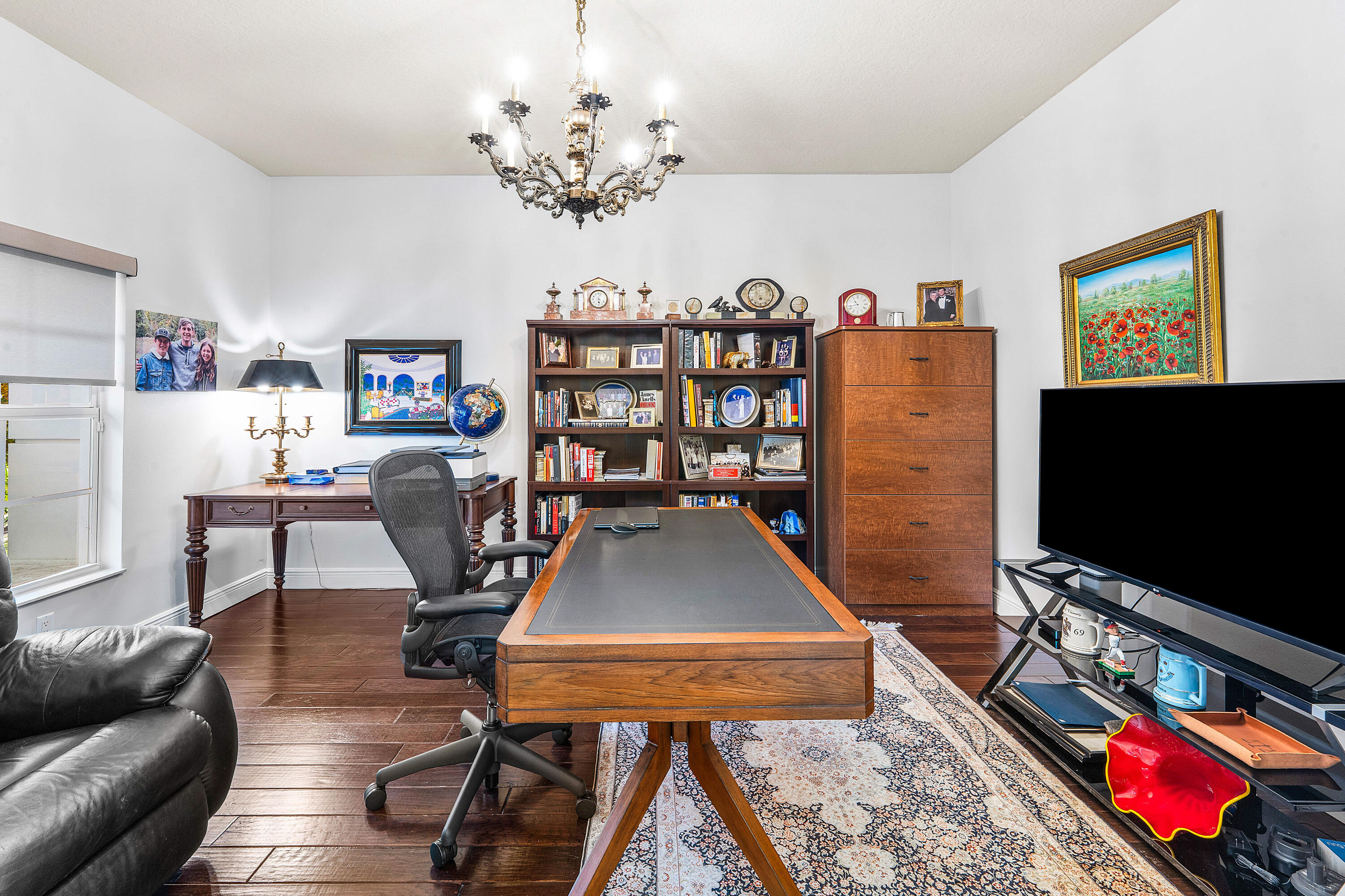 8850 Valhalla Drive Delray Beach, FL 33446 - Photo 37 of 71 a living room with furniture and a flat screen tv