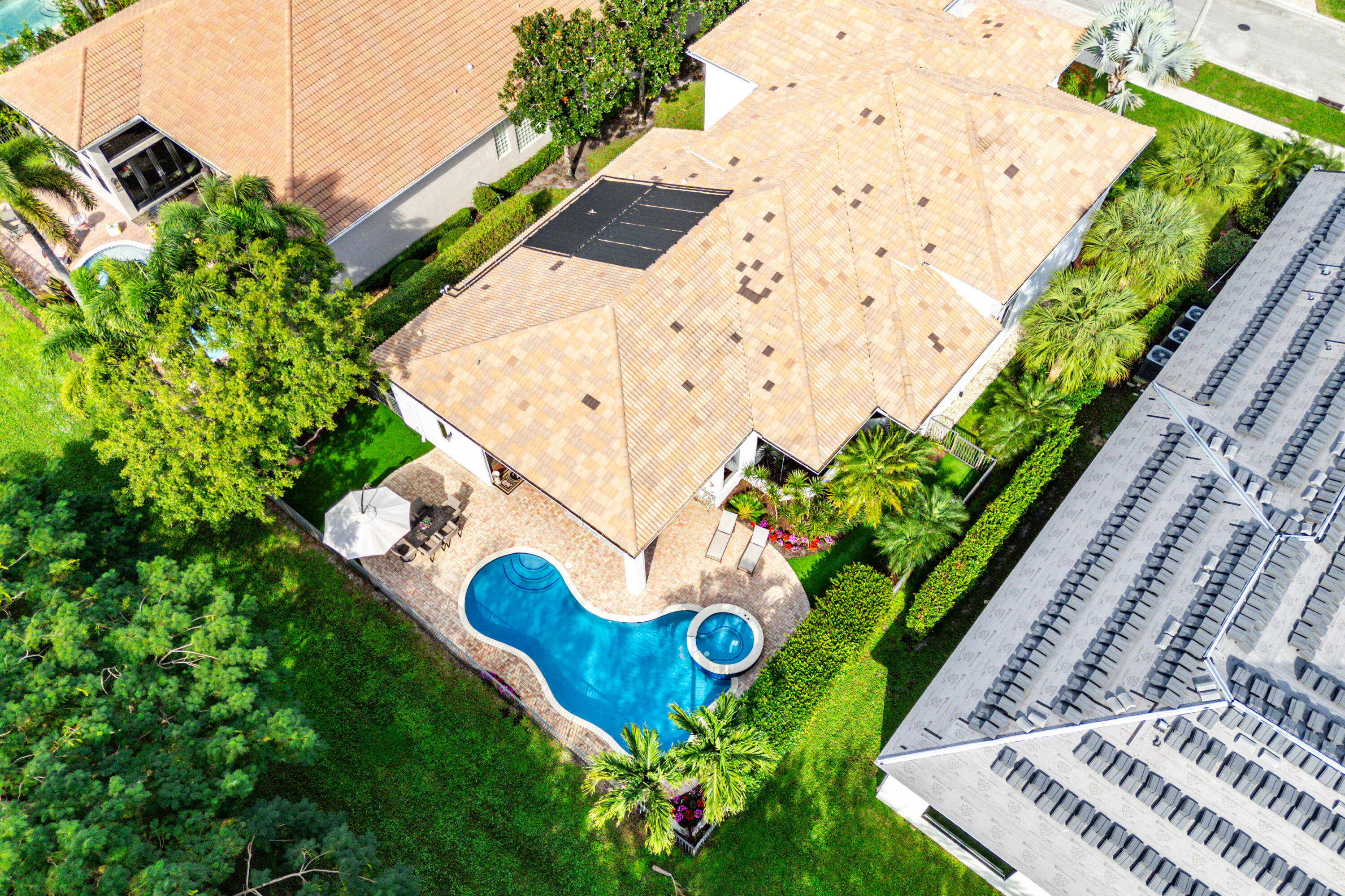 8850 Valhalla Drive Delray Beach, FL 33446 - Photo 62 of 71 a view of swimming pool with a yard