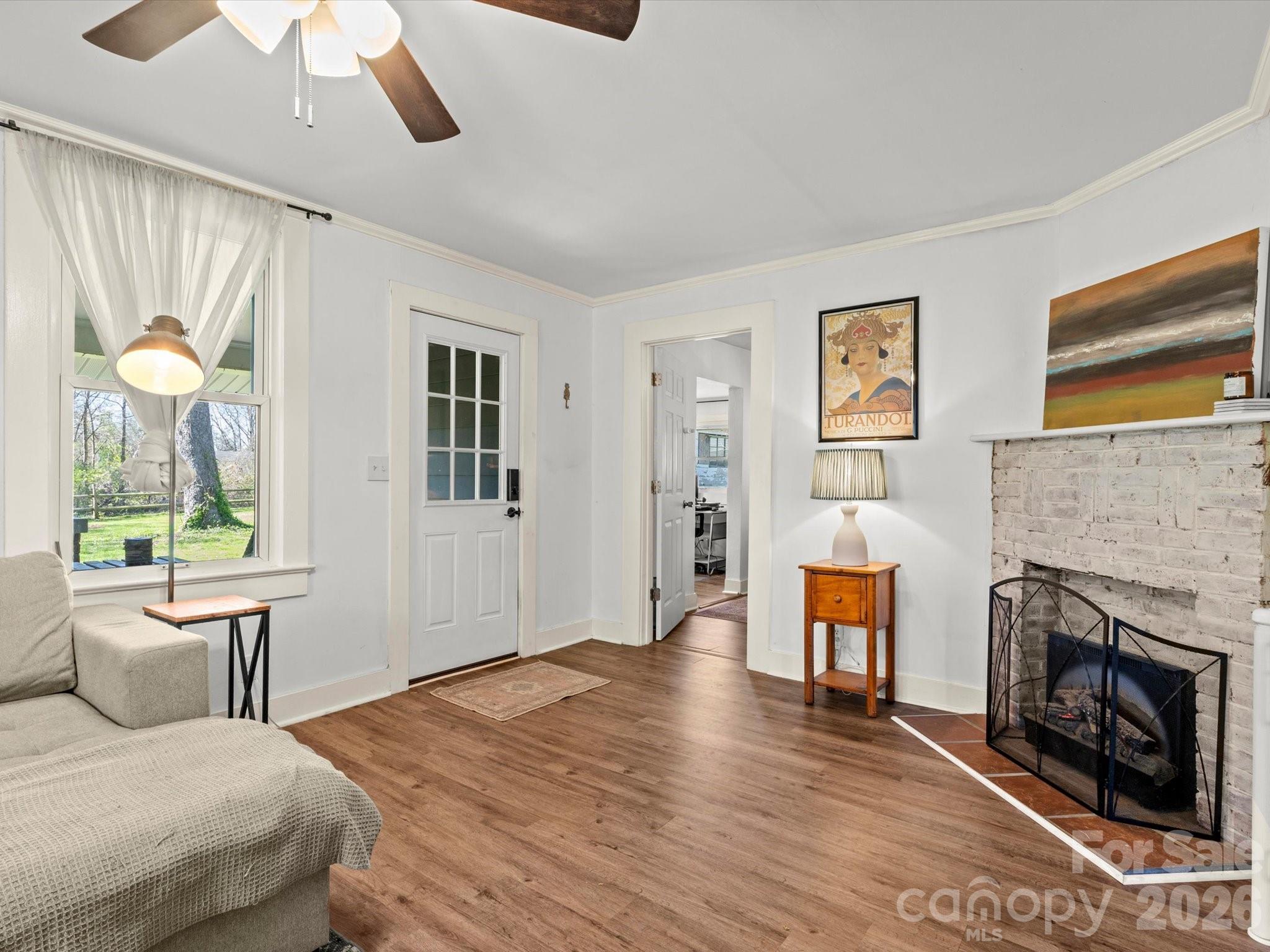 12 Maple Lane Arden, NC 28704 - Photo 13 of 31 a bedroom with a bed and a fireplace