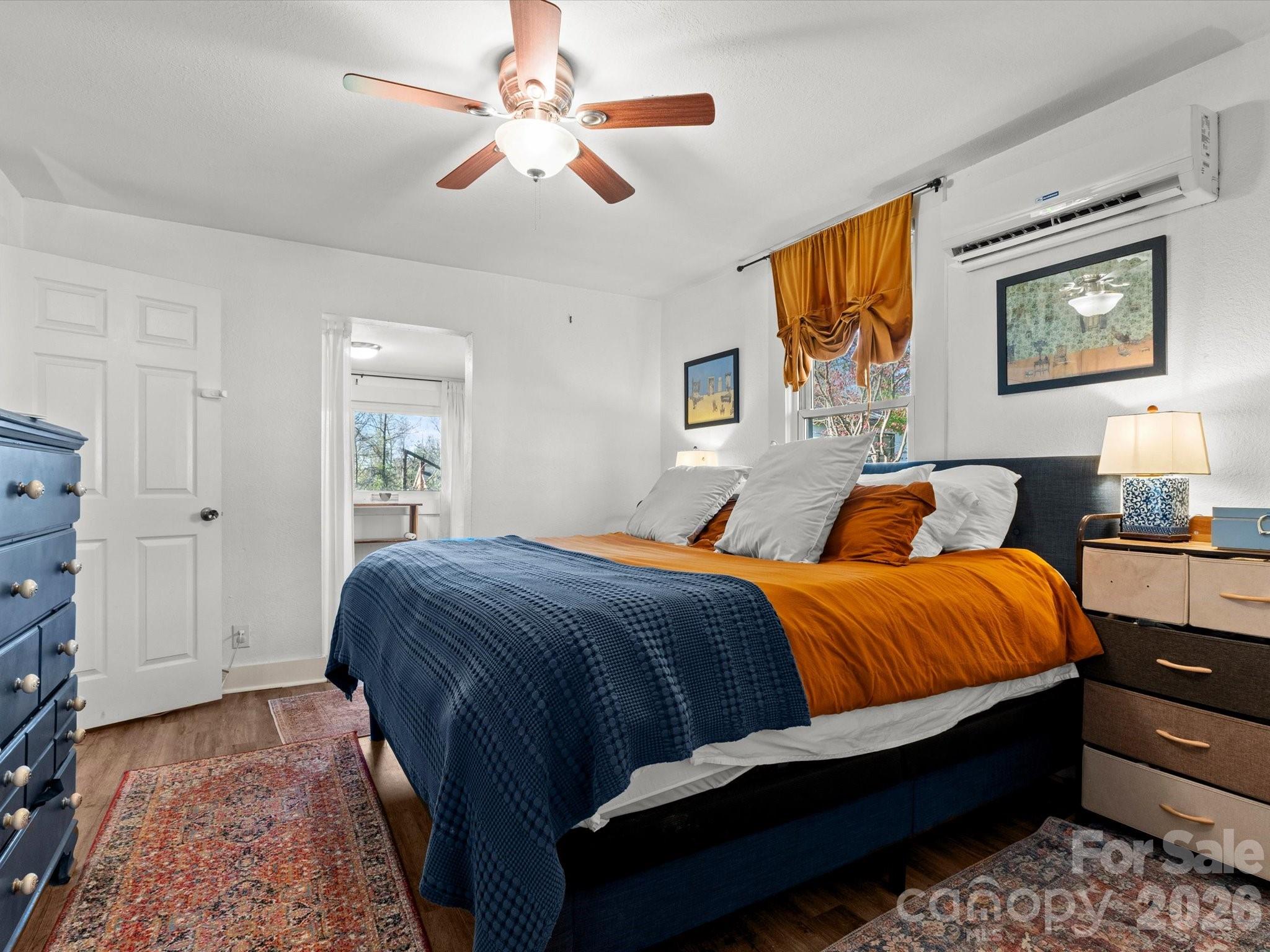 12 Maple Lane Arden, NC 28704 - Photo 14 of 31 a bedroom with a bed and wooden floor
