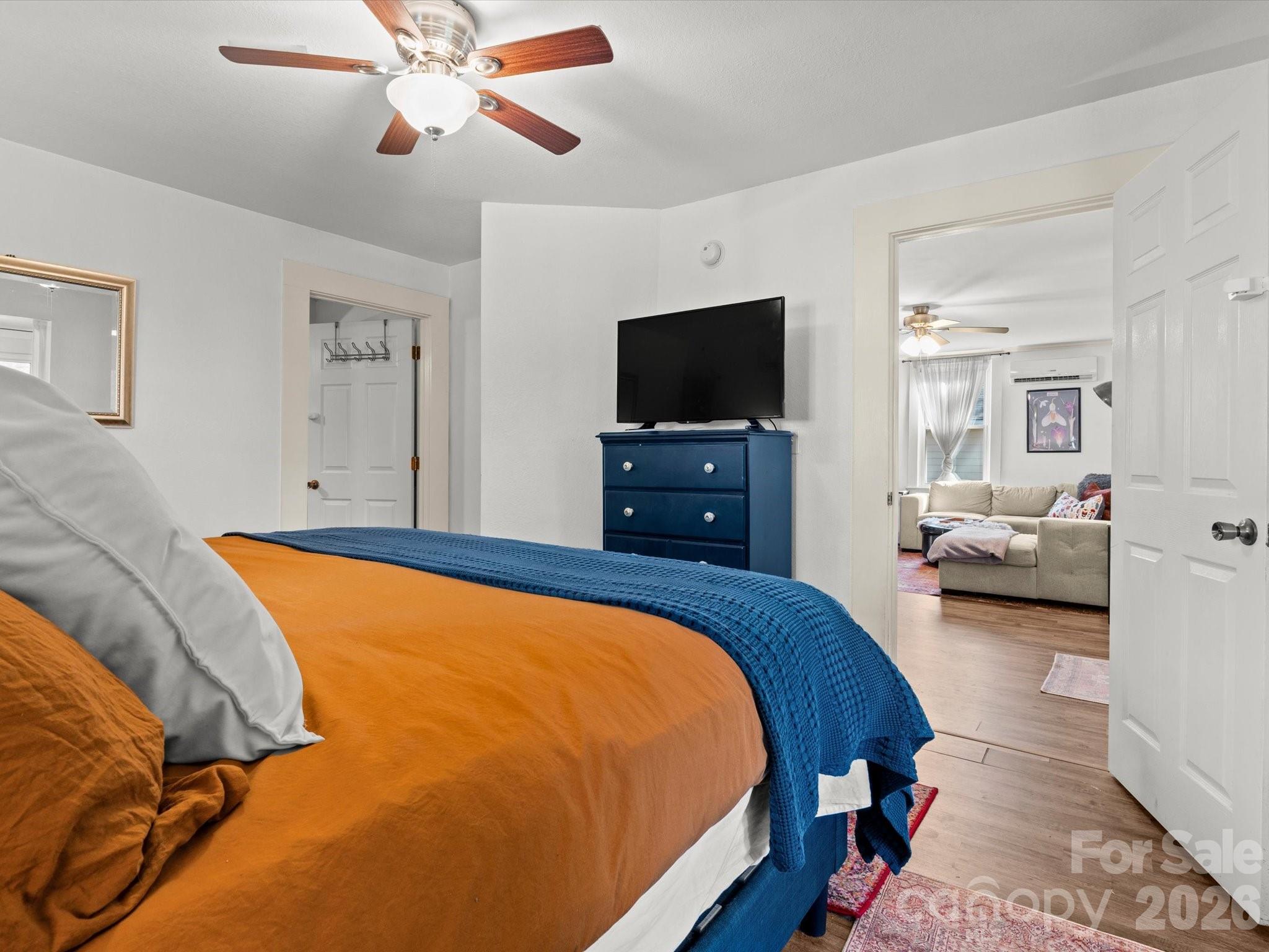 12 Maple Lane Arden, NC 28704 - Photo 15 of 31 a bedroom with a bed and a flat screen tv