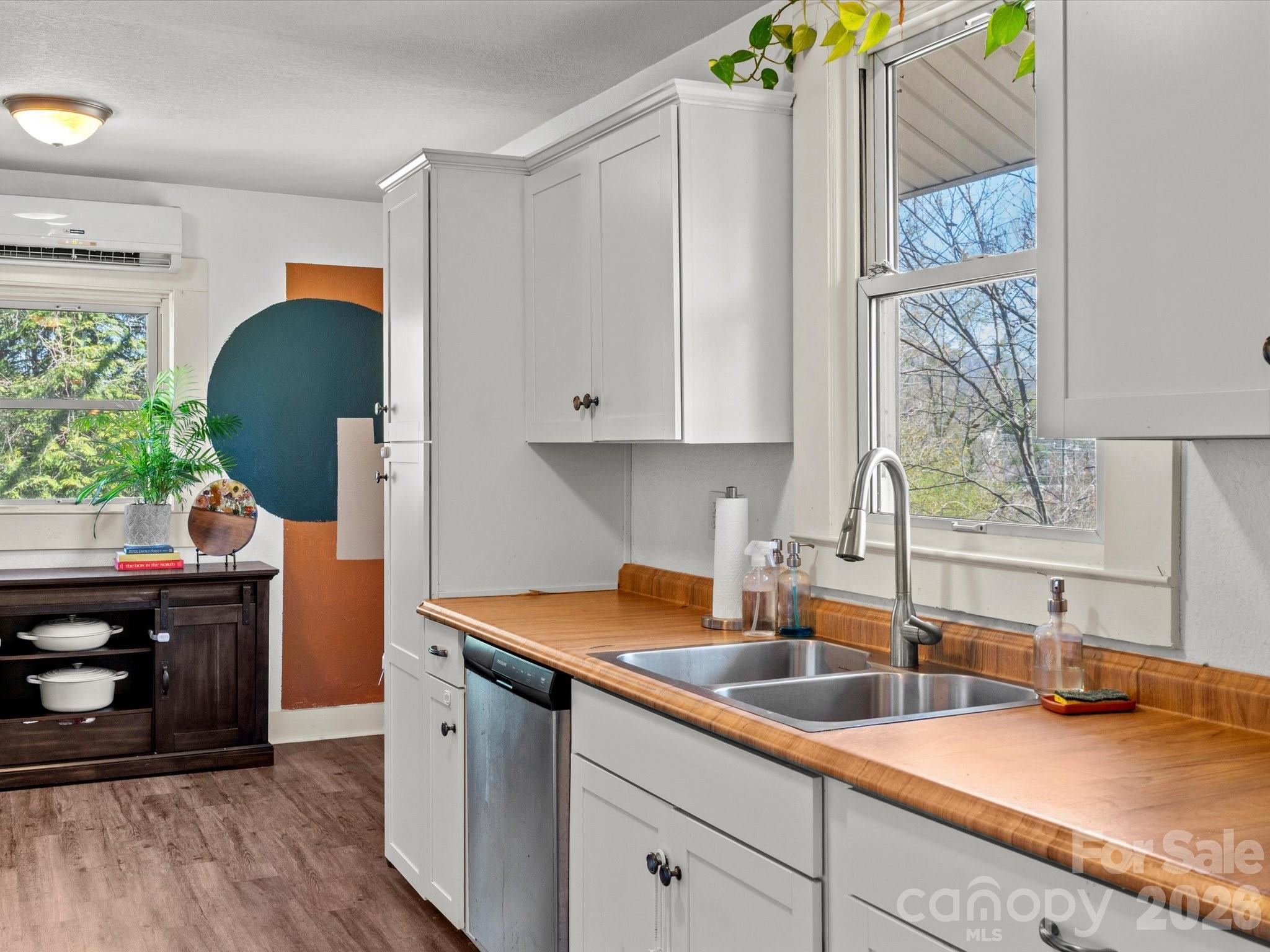 12 Maple Lane Arden, NC 28704 - Photo 25 of 31 a kitchen with stainless steel appliances a sink a stove and a wooden floor