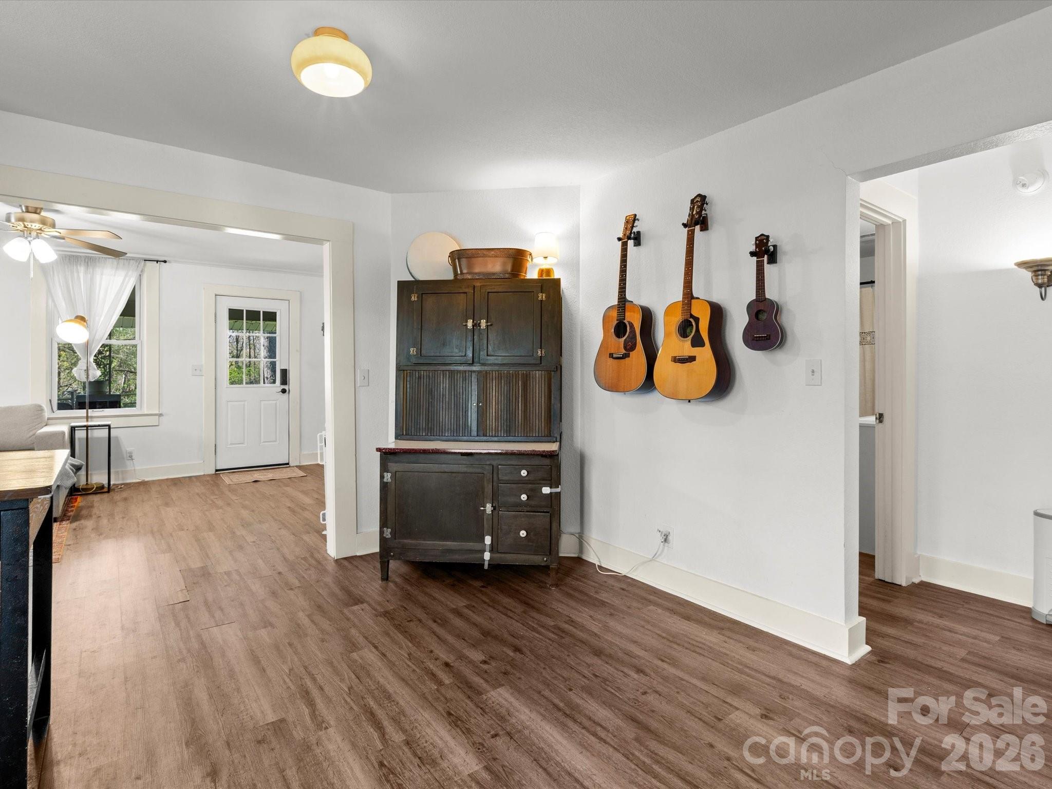 12 Maple Lane Arden, NC 28704 - Photo 29 of 31 a view of a bedroom with wooden floor and white walls