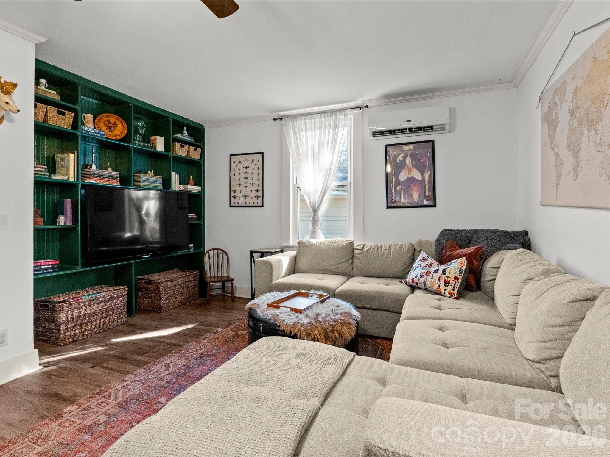 12 Maple Lane Arden, NC 28704 - Photo 8 of 31 a living room with furniture workspace and a flat screen tv