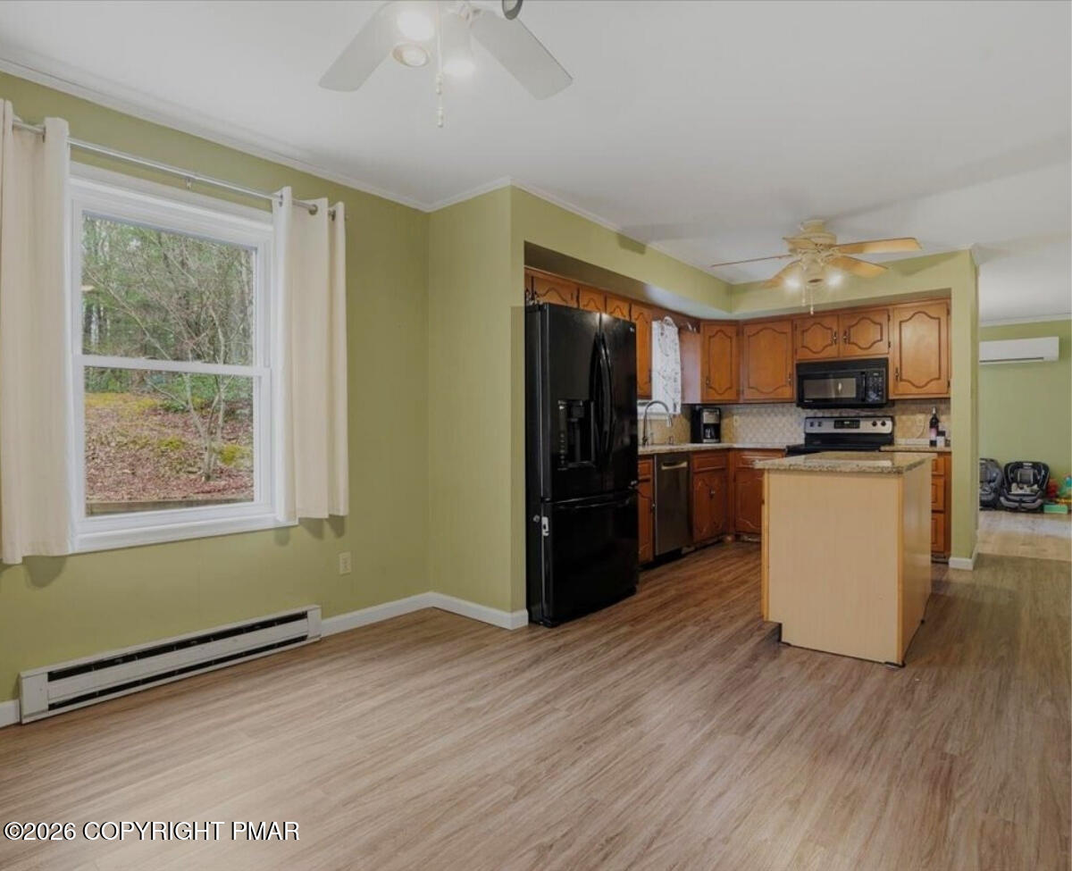 239 Sundance Road Effort, PA 18330 - Photo 15 of 60 a kitchen with stainless steel appliances granite countertop a refrigerator and a stove top oven