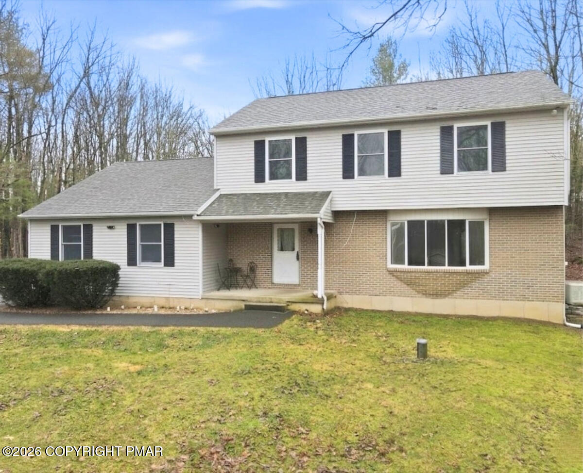 239 Sundance Road Effort, PA 18330 - Photo 41 of 60 a front view of a house with garden