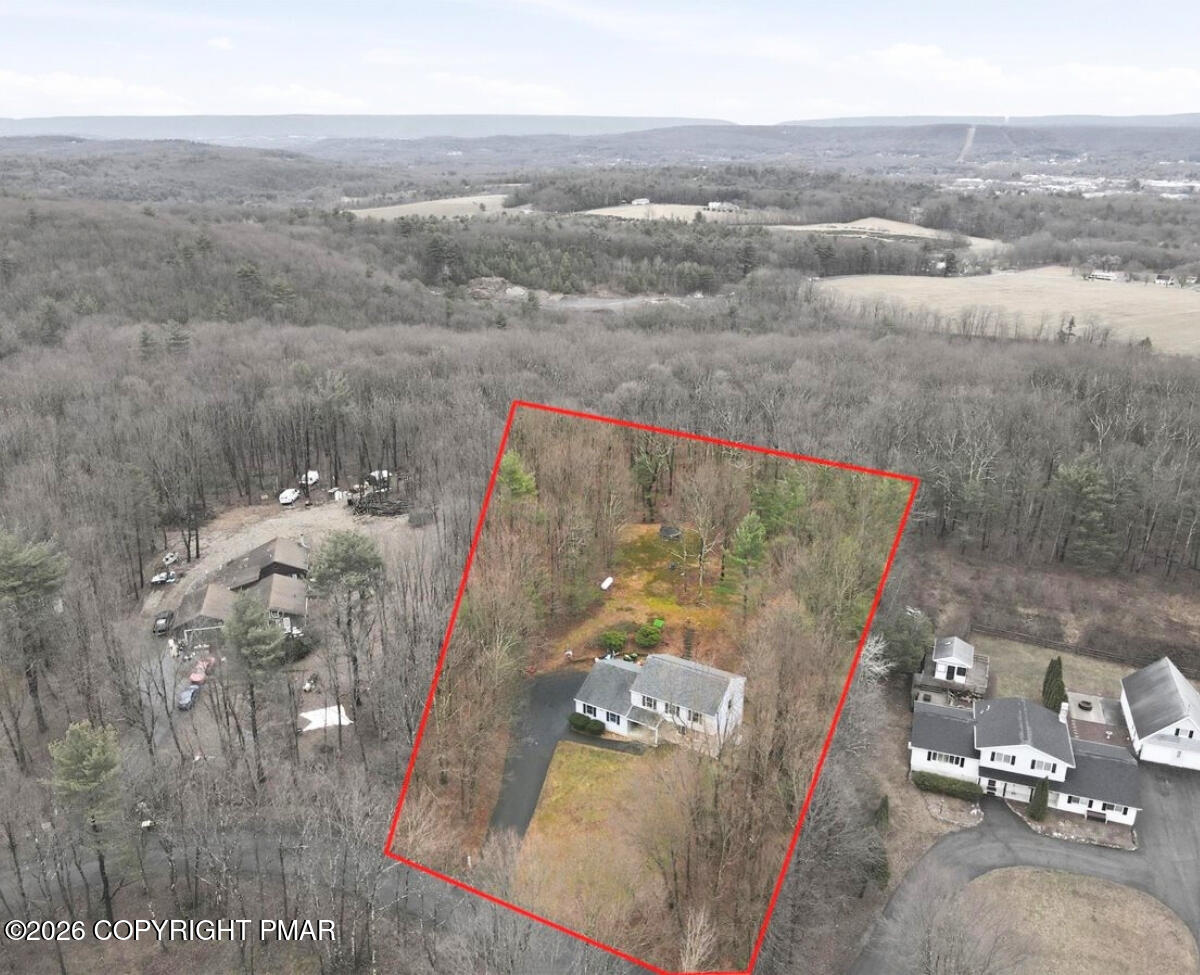 239 Sundance Road Effort, PA 18330 - Photo 51 of 60 an aerial view of a house with a yard and lake view