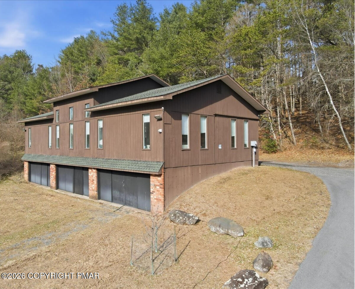 239 Sundance Road Effort, PA 18330 - Photo 56 of 60 a front view of a house with a yard and garage