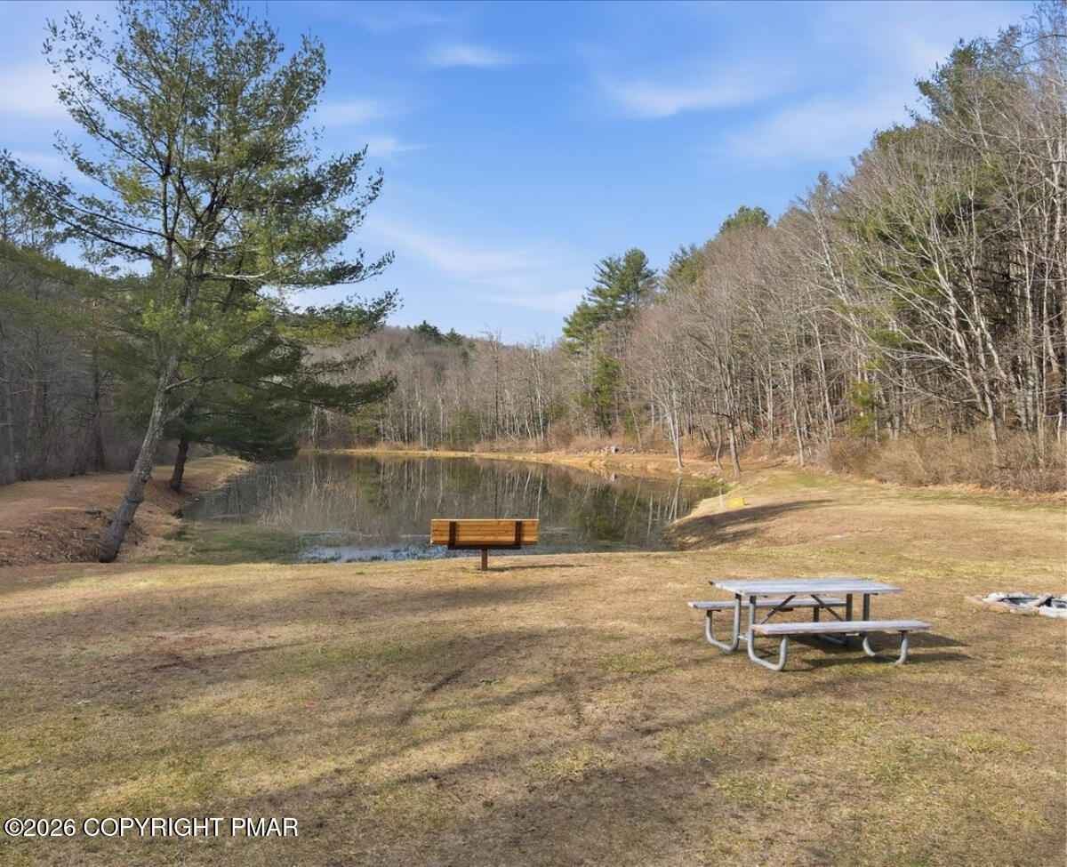 239 Sundance Road Effort, PA 18330 - Photo 57 of 60 a view of a lake with trees and houses in the background