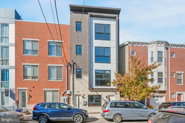 a front view of a building with parking space