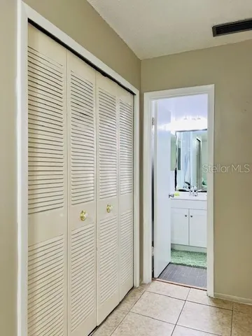 view of an empty room with mirror