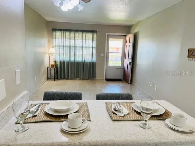 a living room with furniture and a window