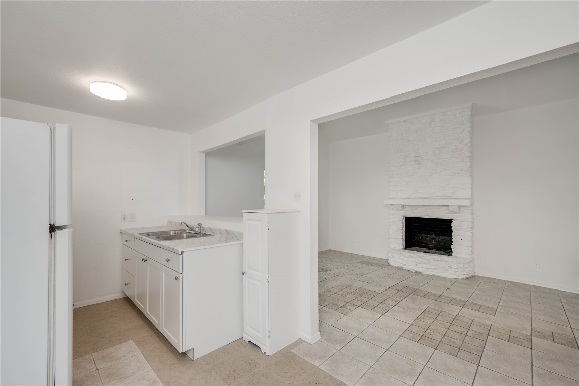 1303 East St Johns Avenue Austin, TX 78752 - Photo 12 of 30 a view of a livingroom with a fireplace