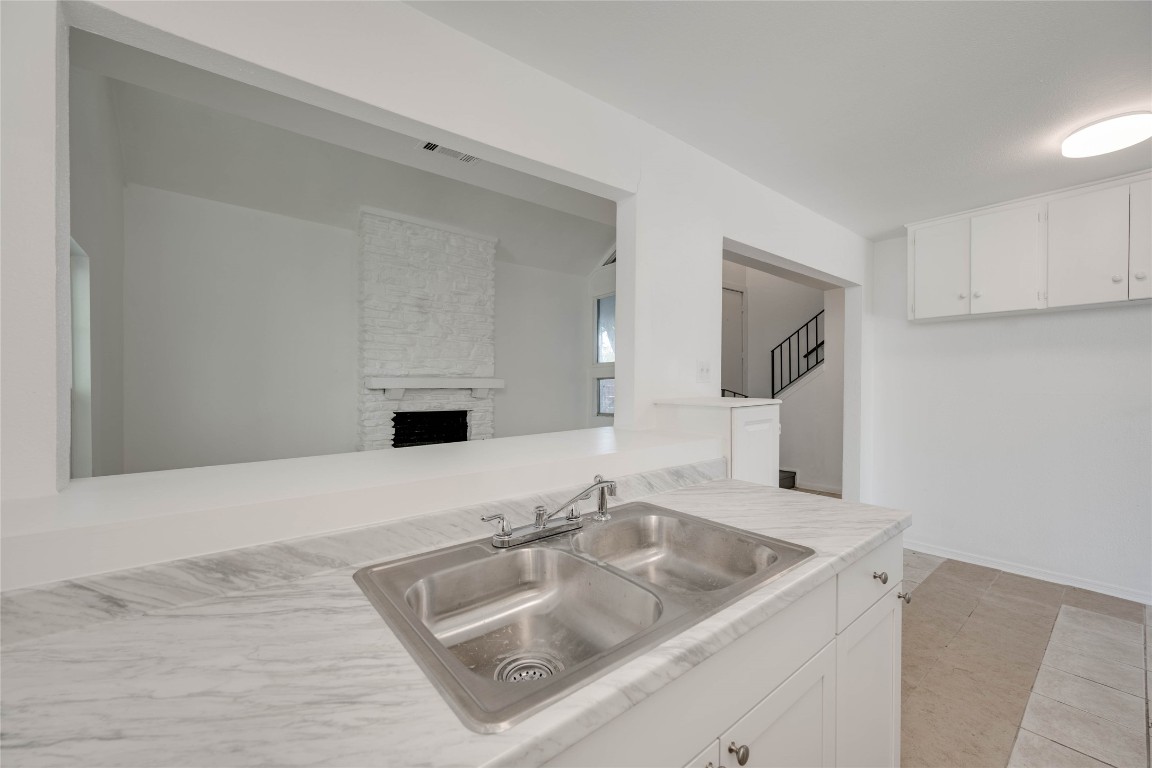 1303 East St Johns Avenue Austin, TX 78752 - Photo 14 of 30 a bathroom with a sink and a mirror