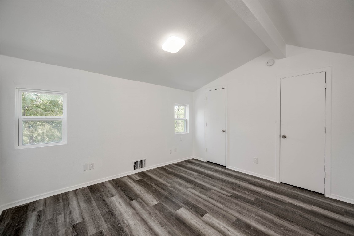 1303 East St Johns Avenue Austin, TX 78752 - Photo 18 of 30 a view of a room with wooden floor and closet