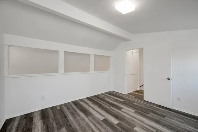 a bathroom with a toilet a sink a mirror and bathtub