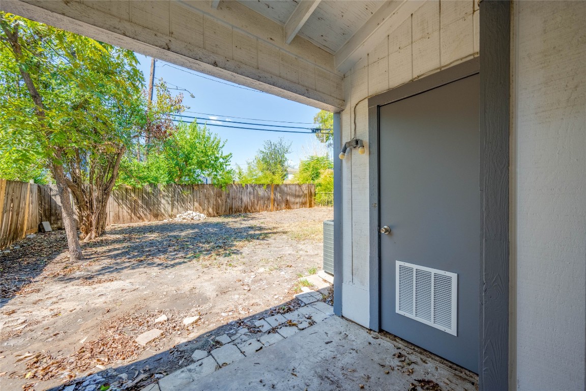 1303 East St Johns Avenue Austin, TX 78752 - Photo 23 of 30 a view of a yard with wooden fence