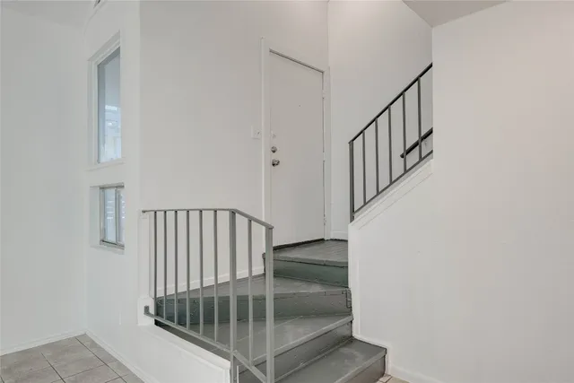 a view of entryway with stairs and wooden floor