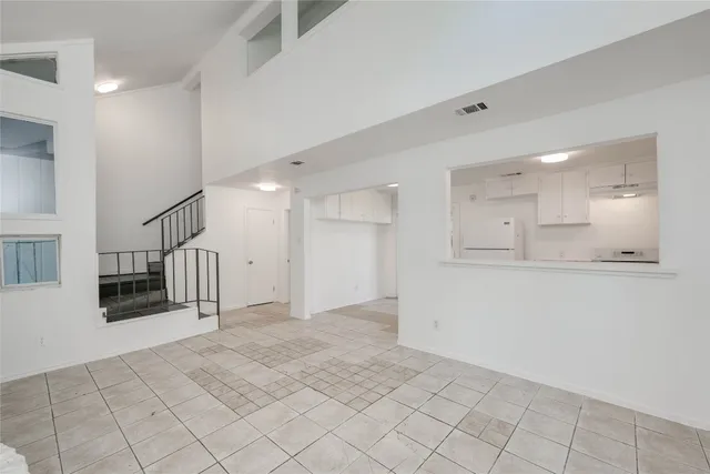 a view of a livingroom with a fireplace and window
