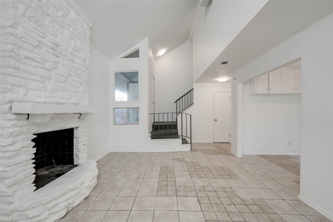1303 East St Johns Avenue Austin, TX 78752 - Photo 8 of 30 a view of a livingroom with a fireplace and window