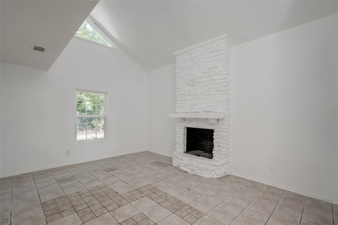 1303 East St Johns Avenue Austin, TX 78752 - Photo 10 of 30 a view of empty room with fireplace